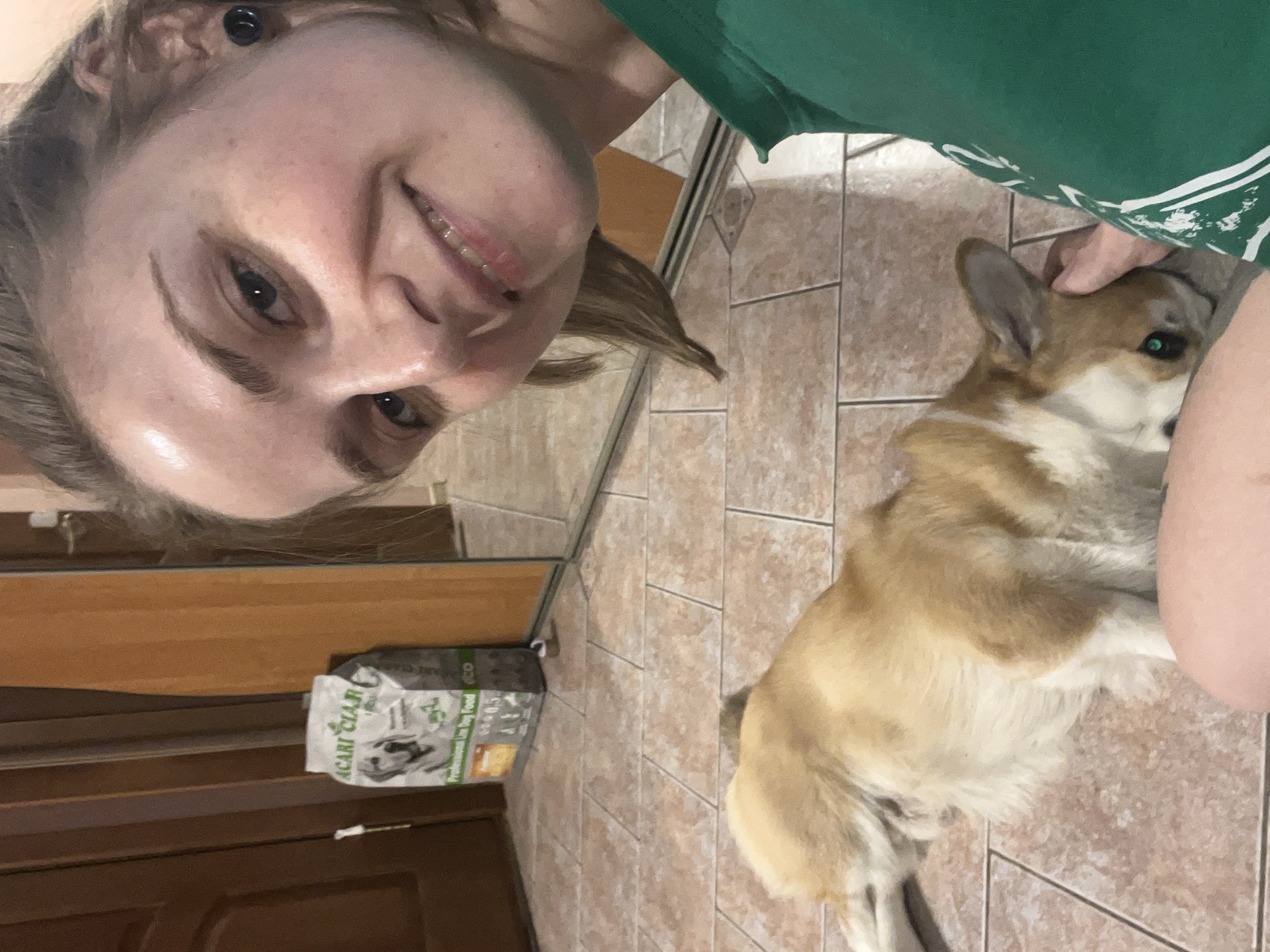 Person and Corgi share quiet moment in Novosibirsk home