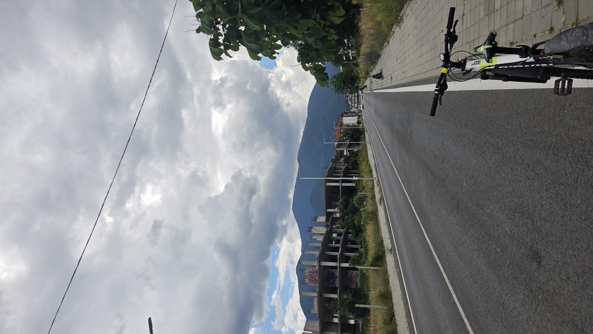Cloudy day on a Bansko street, bicycle parked nearby