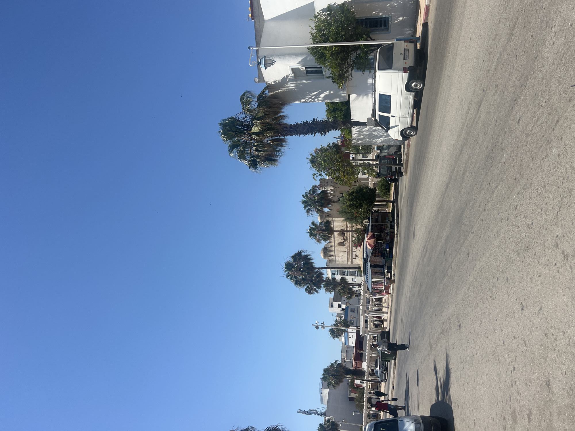 Tourist documents historic sites and infrastructure in Martil, Morocco