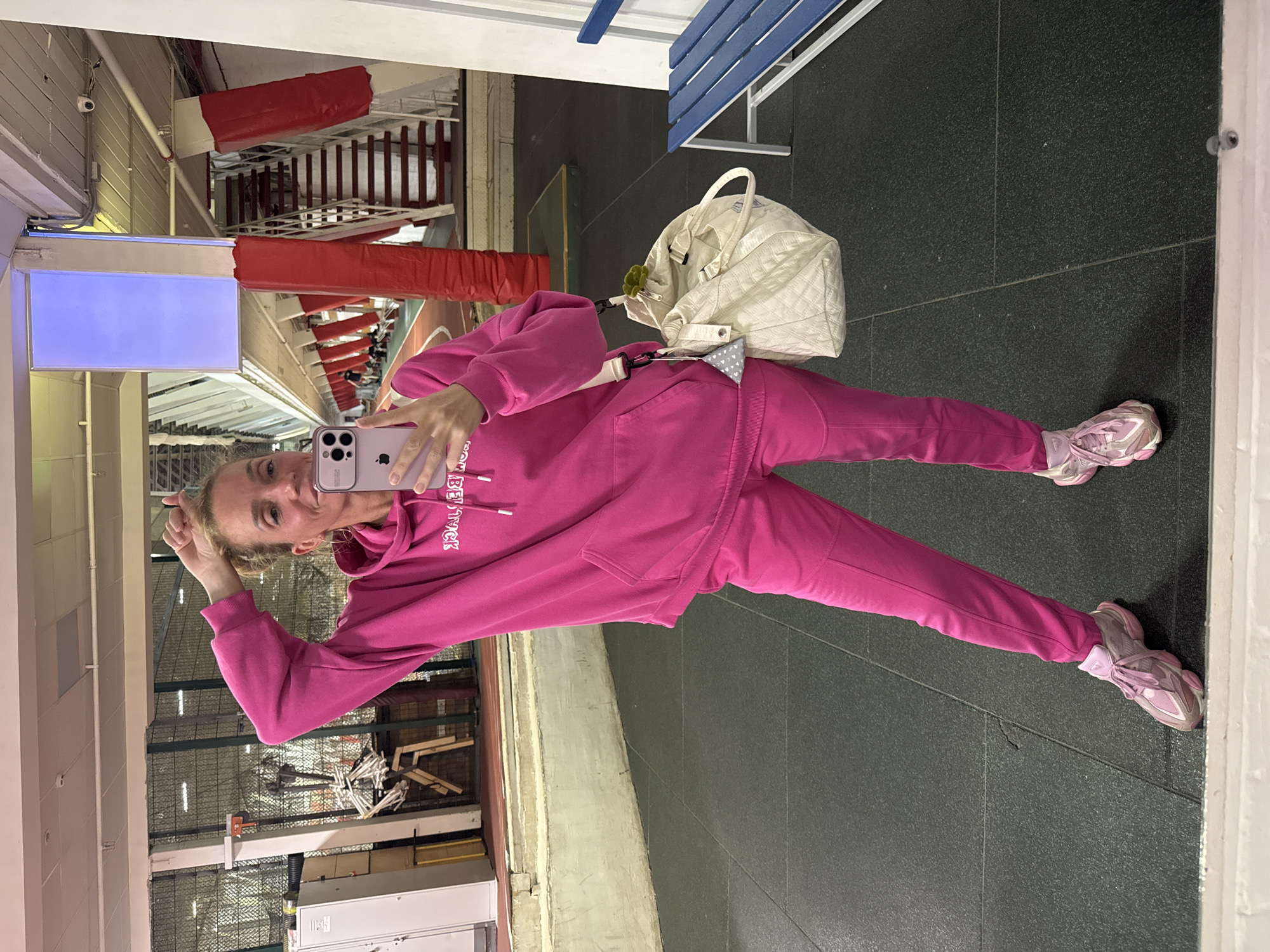 Woman takes selfie at sports facility in Murino, Russia