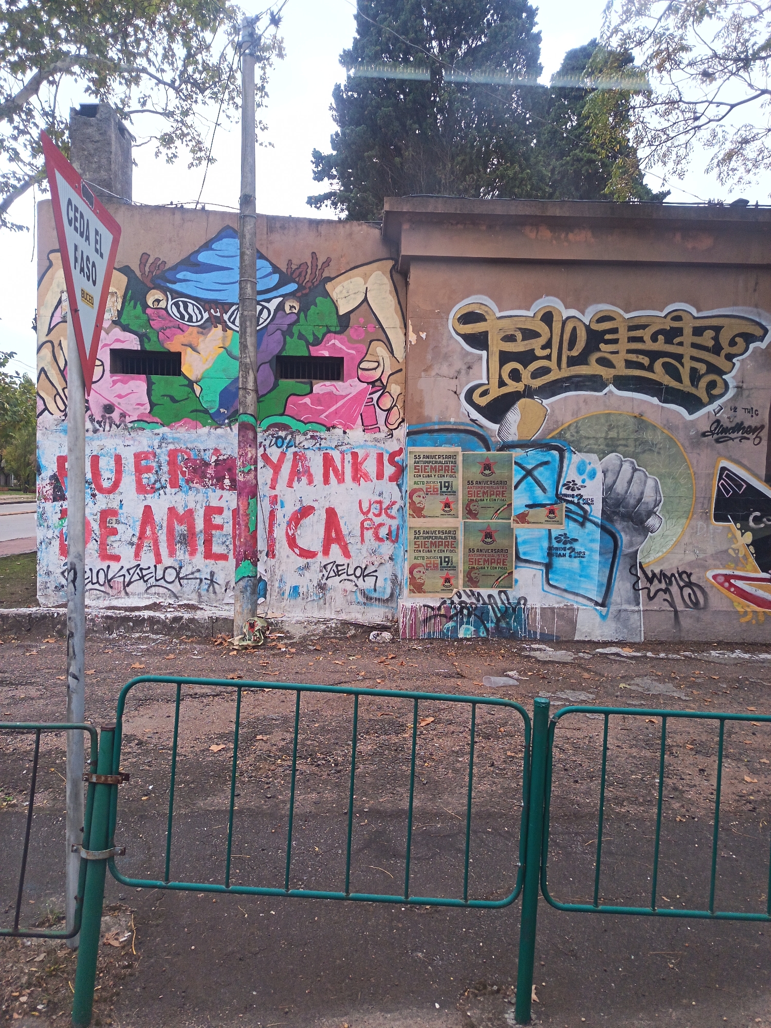 Street art and political posters documented on Montevideo wall