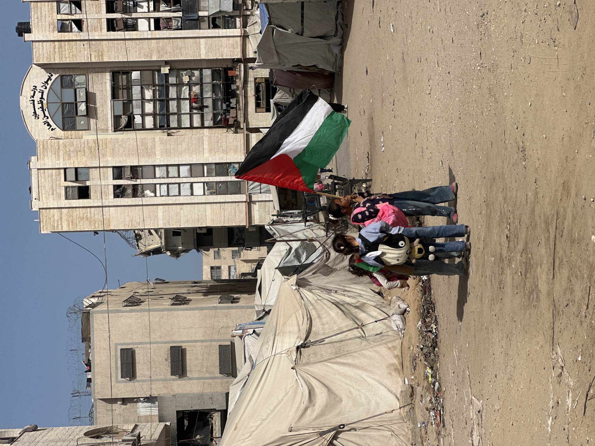 Gaza residents navigate daily life amid camps and damaged buildings