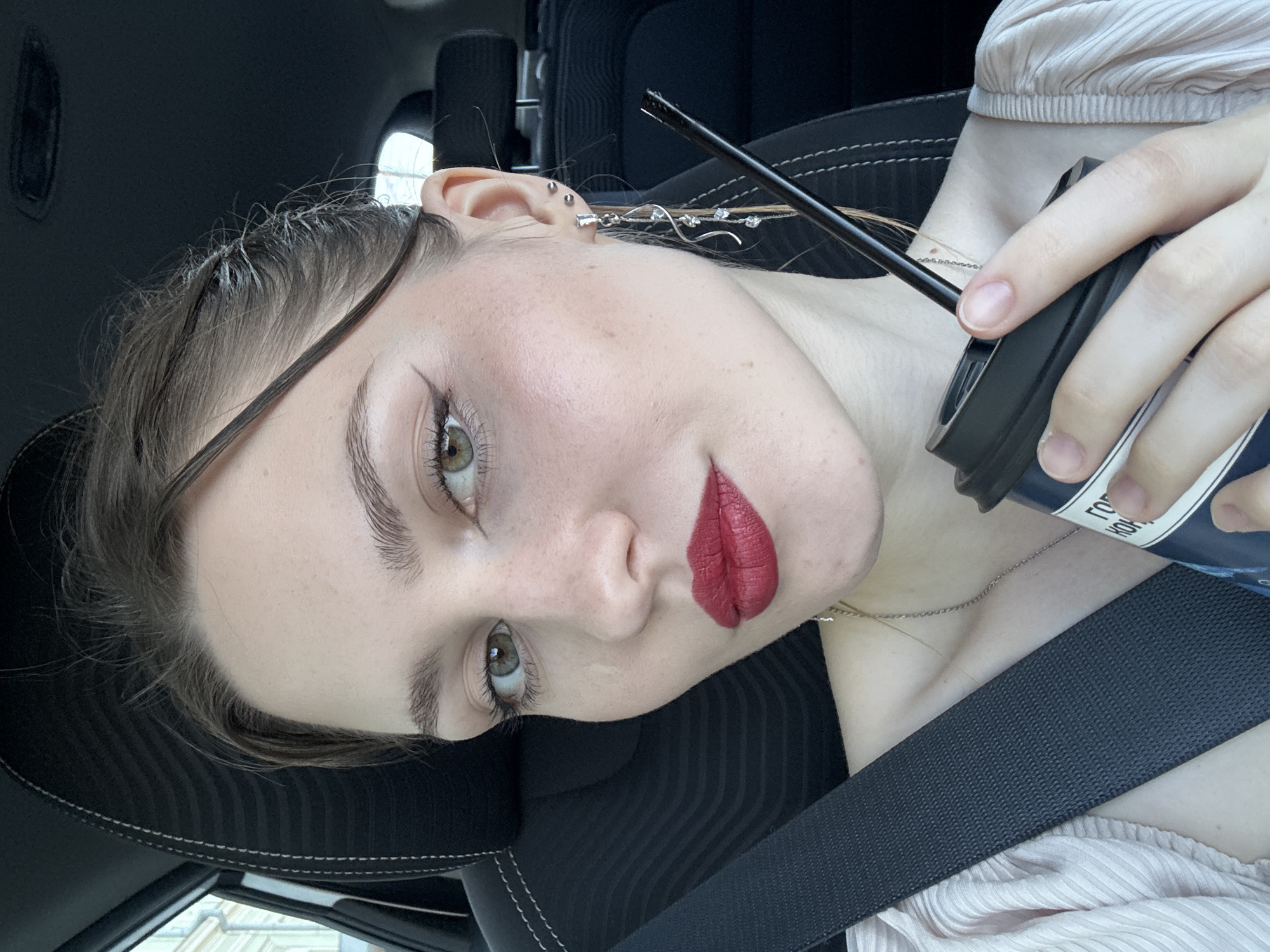 Woman Takes Selfie Inside Vehicle in Saint Petersburg