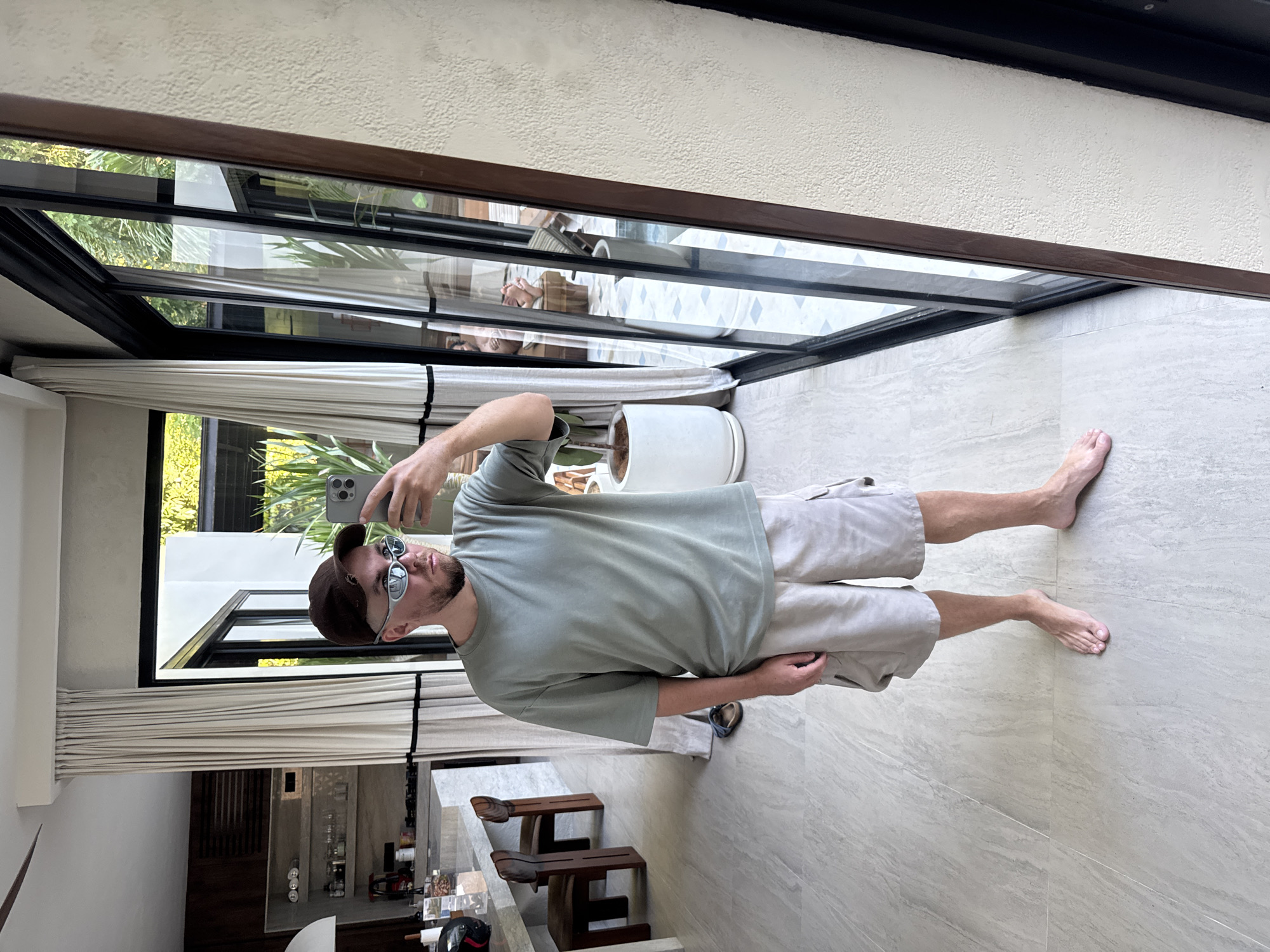 Tourist captures morning selfies in Kuta Selatan hotel room