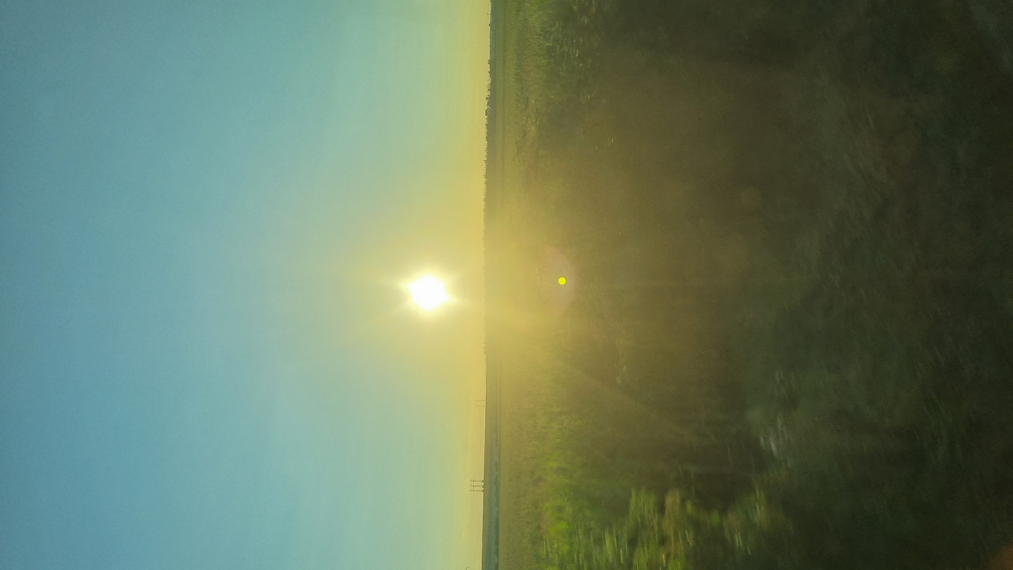Golden hour over crop fields in rural Romania