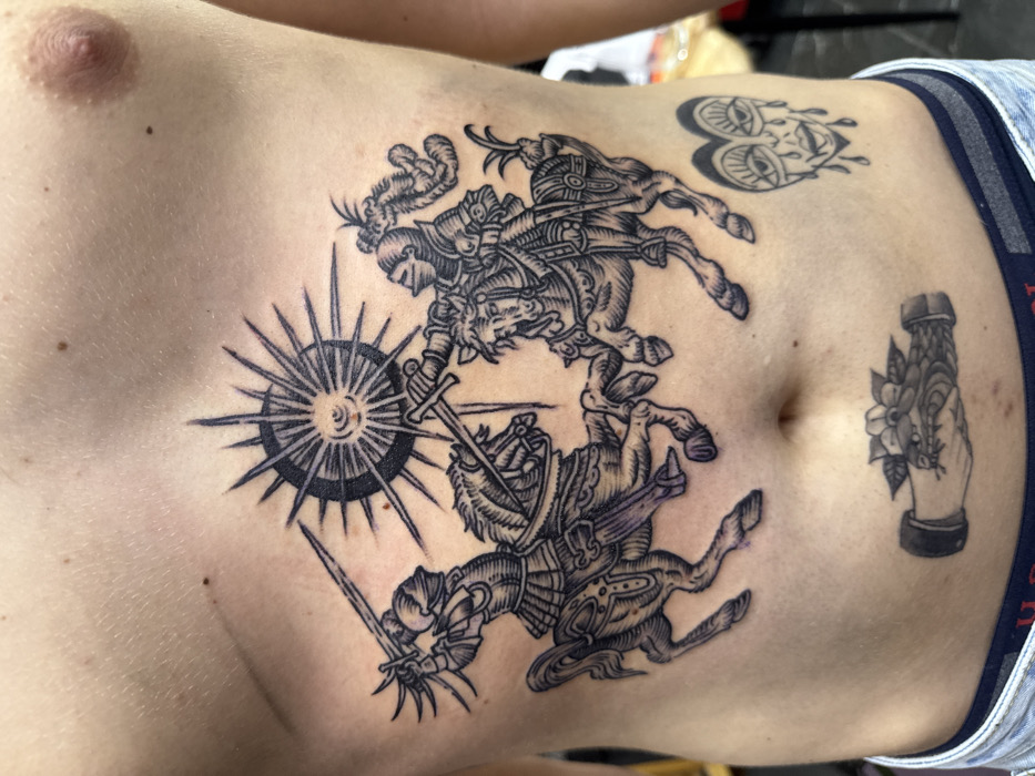 Tattooed torso documented in Moscow street photography