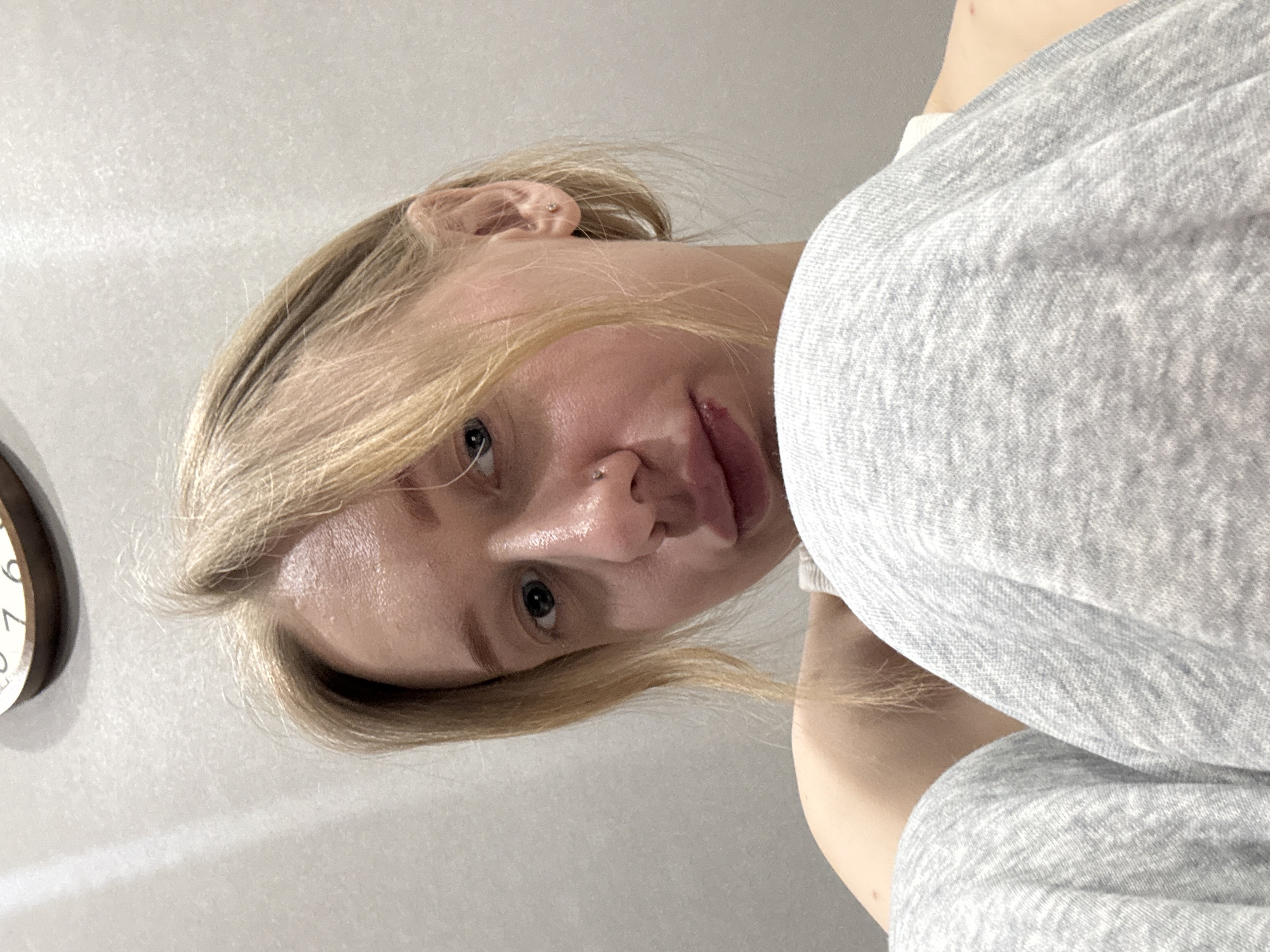 Woman takes multiple selfies indoors in Rostov-on-Don
