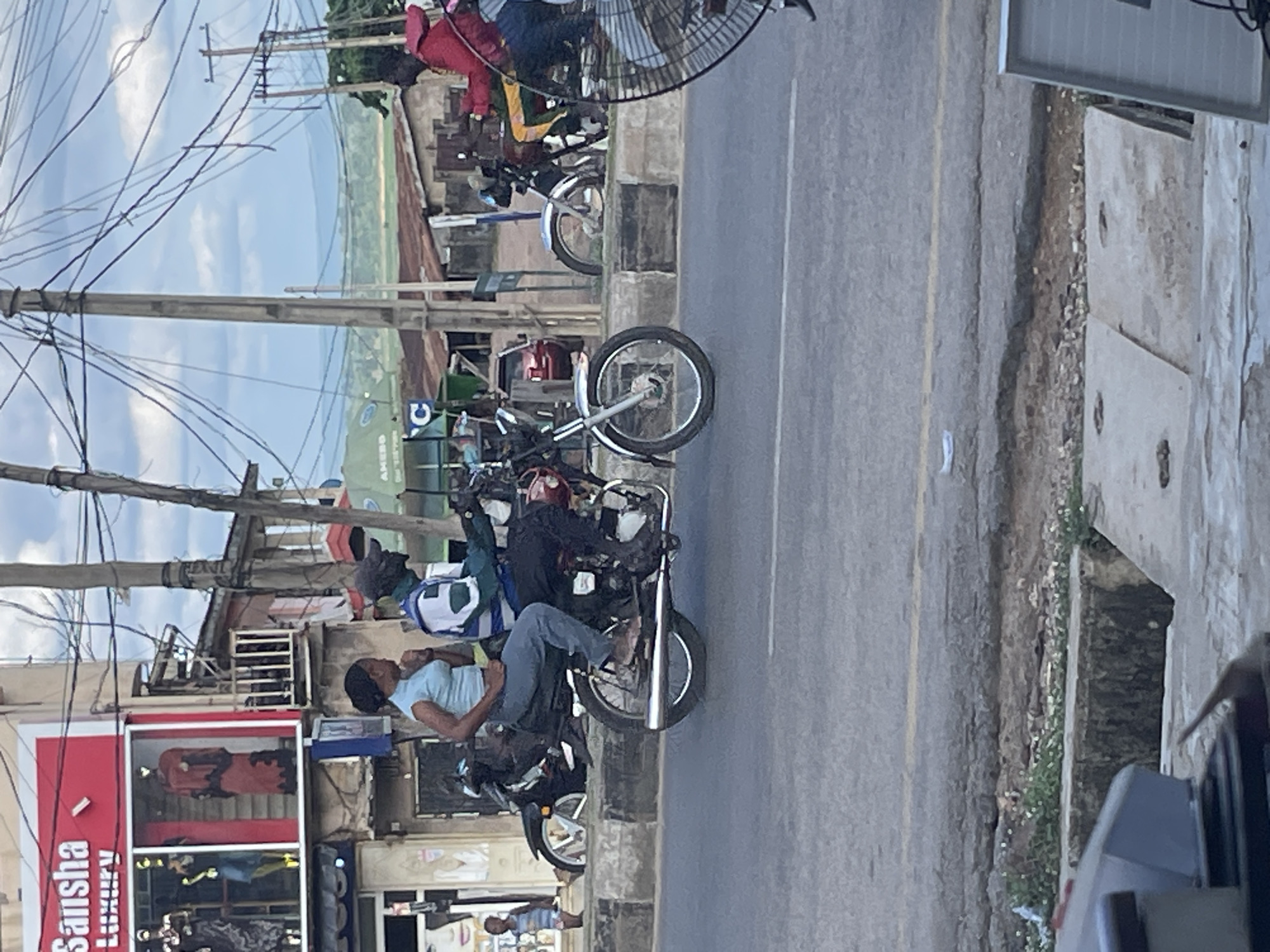Goats, rickshaws, and street life in a busy urban stretch