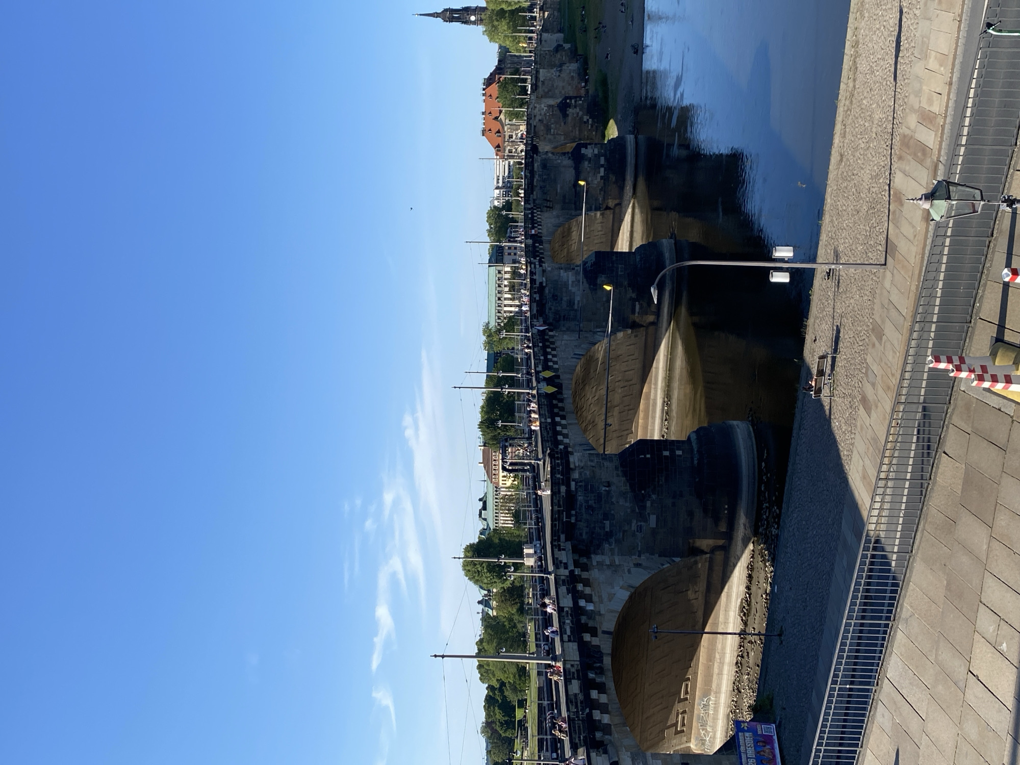Tourist documents Dresden landmarks during afternoon walking tour