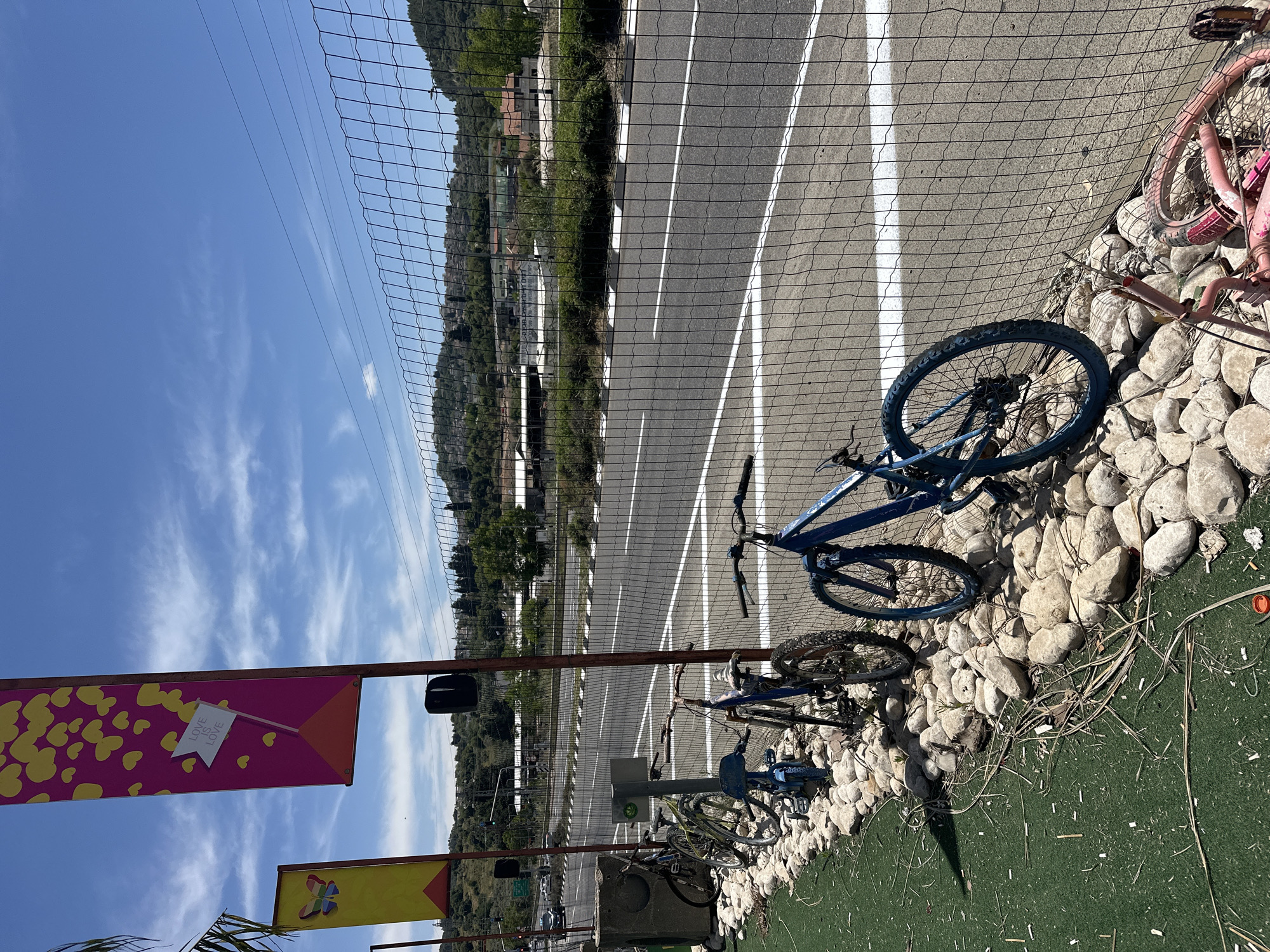 Bicycles lined along fence in Maalot-Tarshiha, Israel