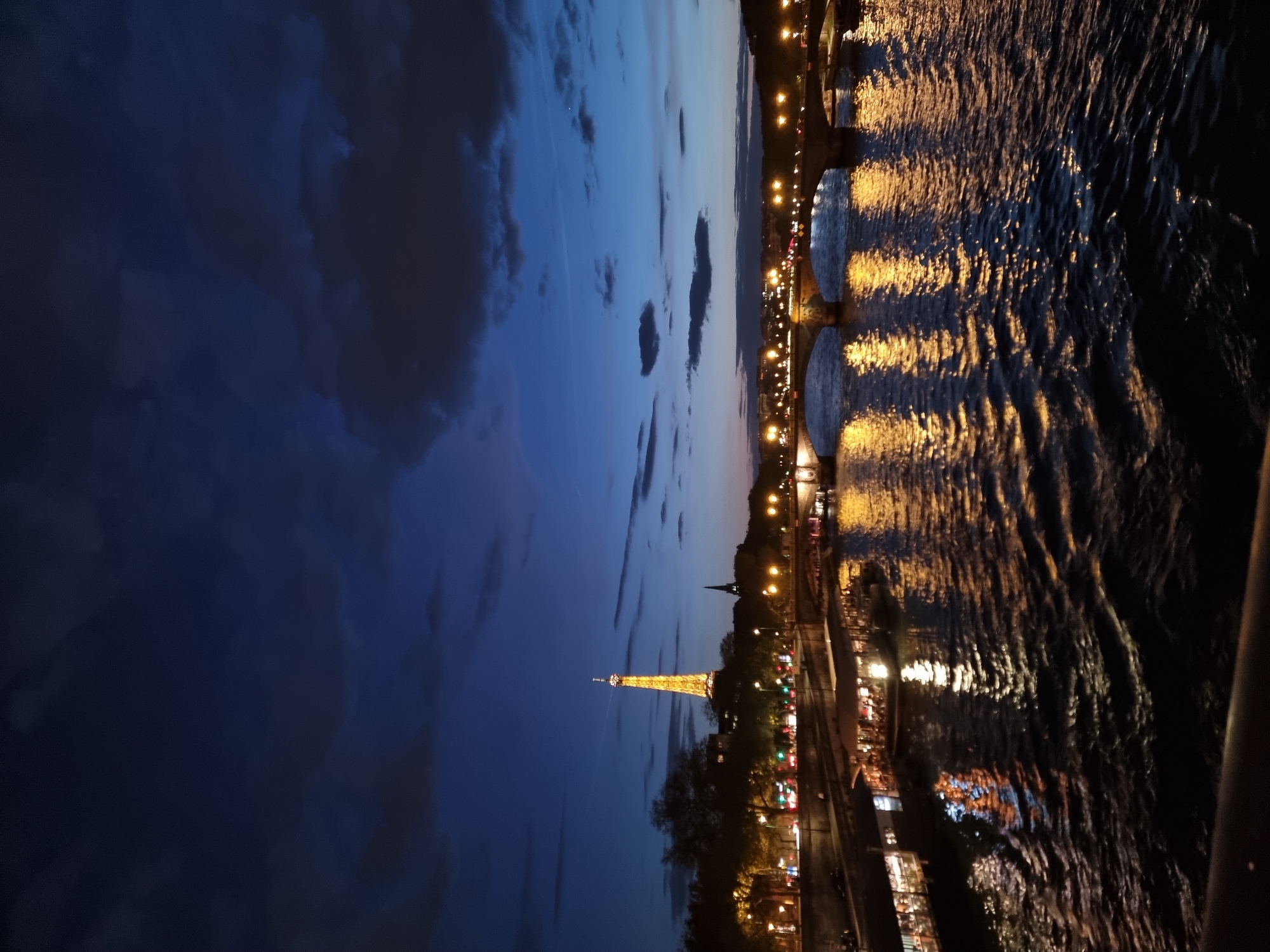 Evening scenes captured at illuminated Eiffel Tower and Alexandre III bridge