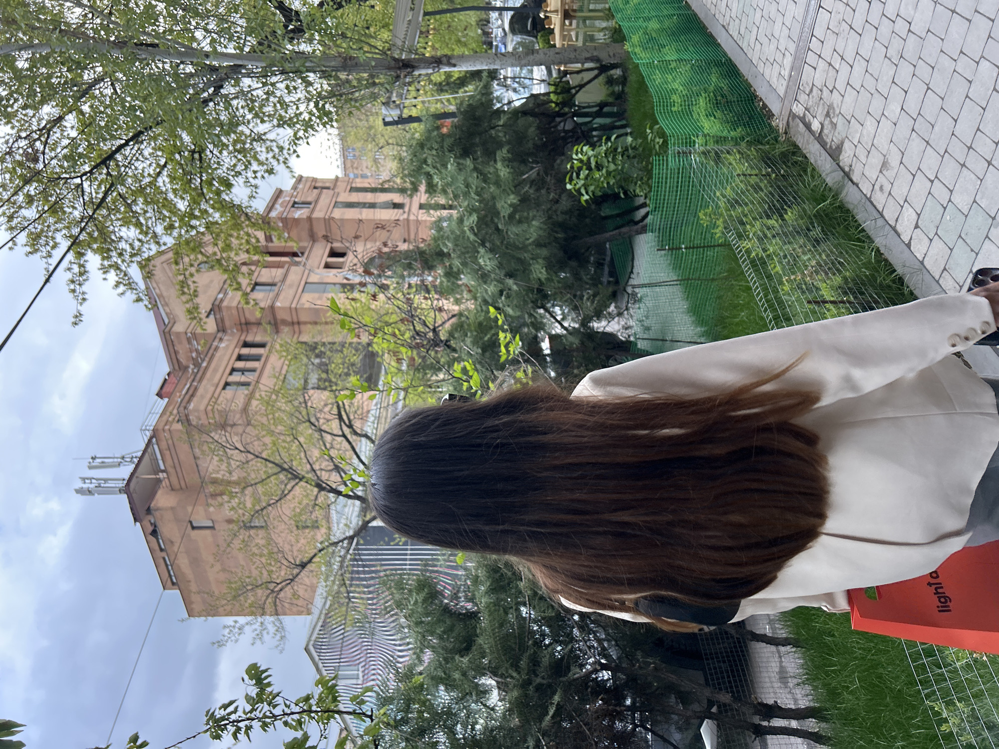 Pedestrians gather on Yerevan streets near Armenian cultural murals