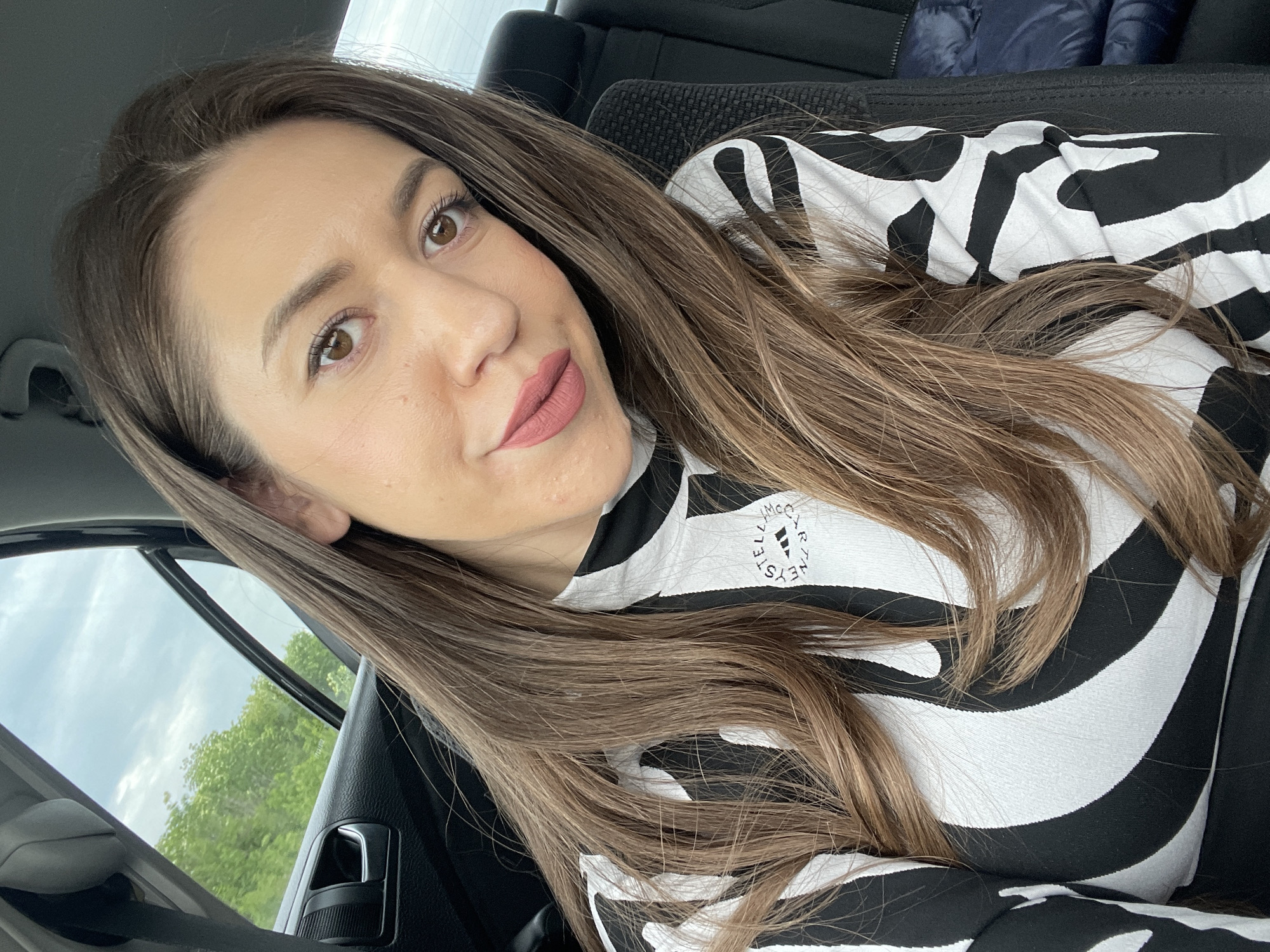 Woman takes selfie in car in Yablanitsa, Bulgaria