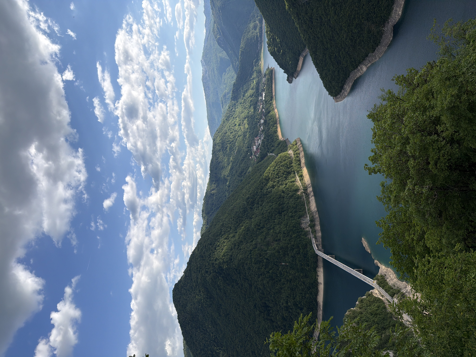 Aerial view captures Piva Lake Bridge spanning waters near Plužine