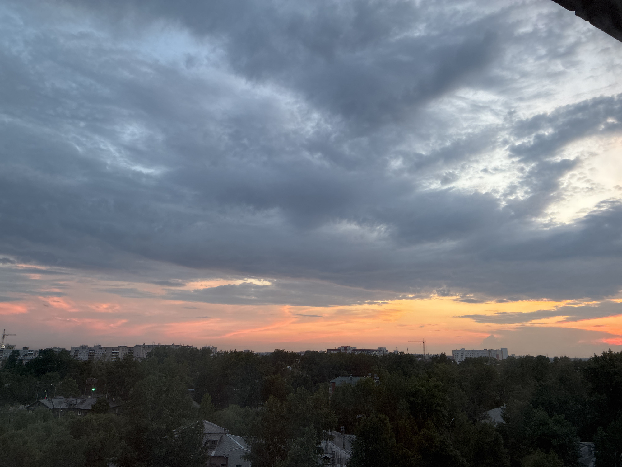 City skyline at dusk, clouds and color across two hours