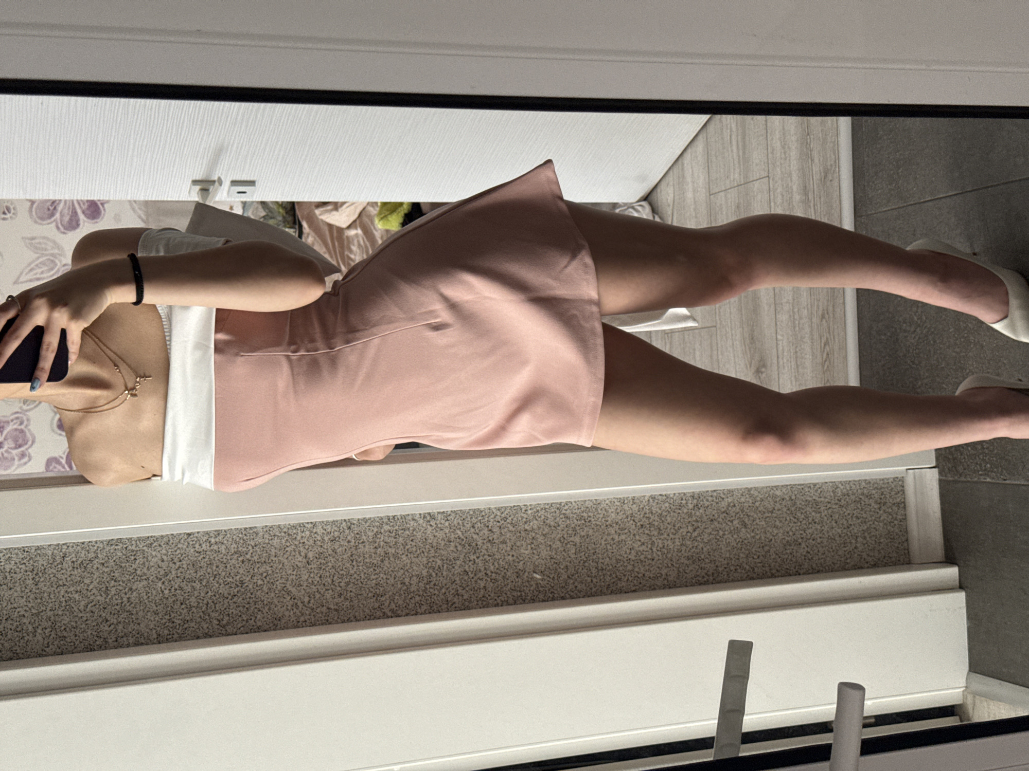 Woman takes mirror selfies in pink dress, Sofia
