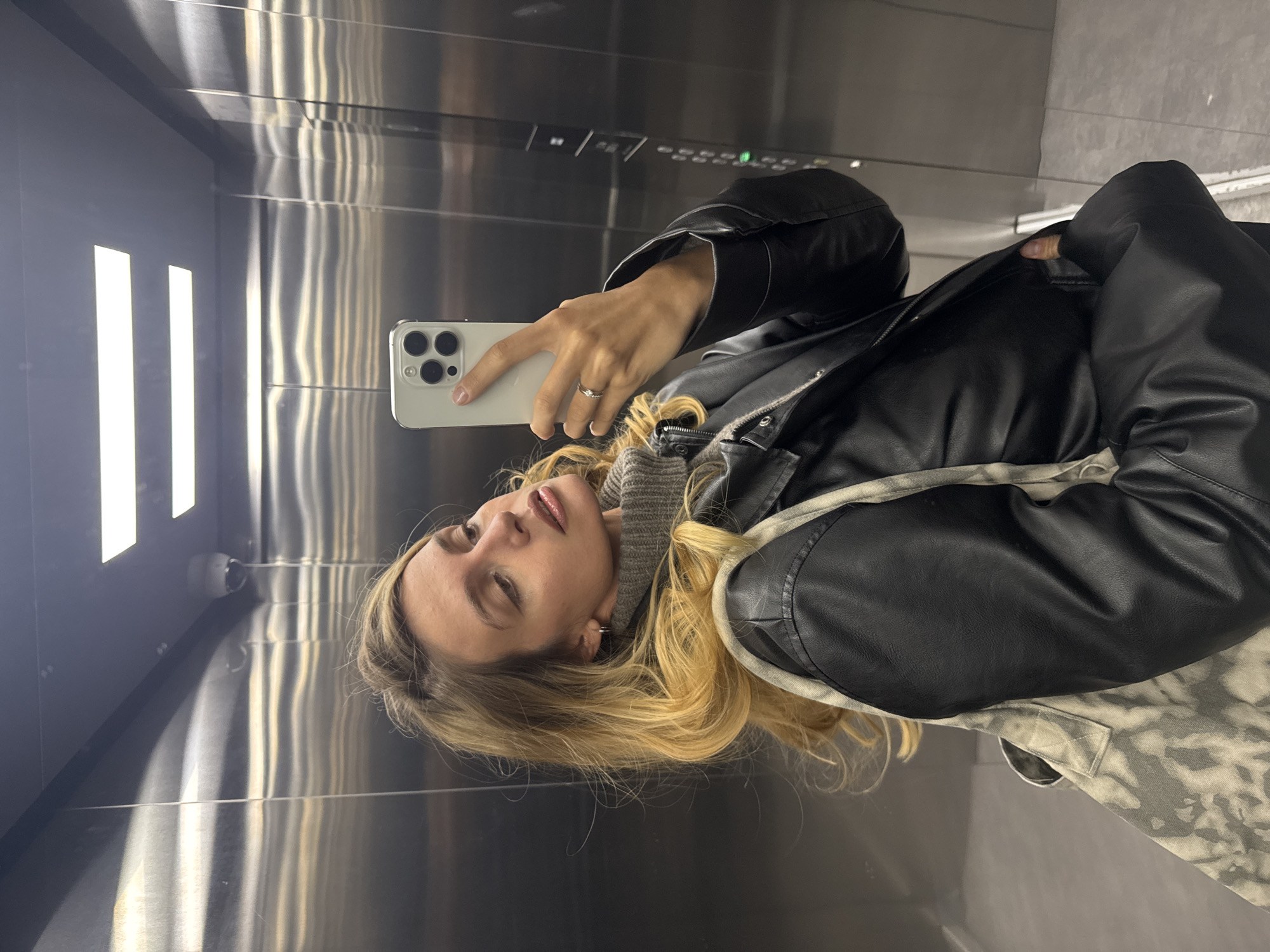 Woman Takes Selfies in Elevator and Car