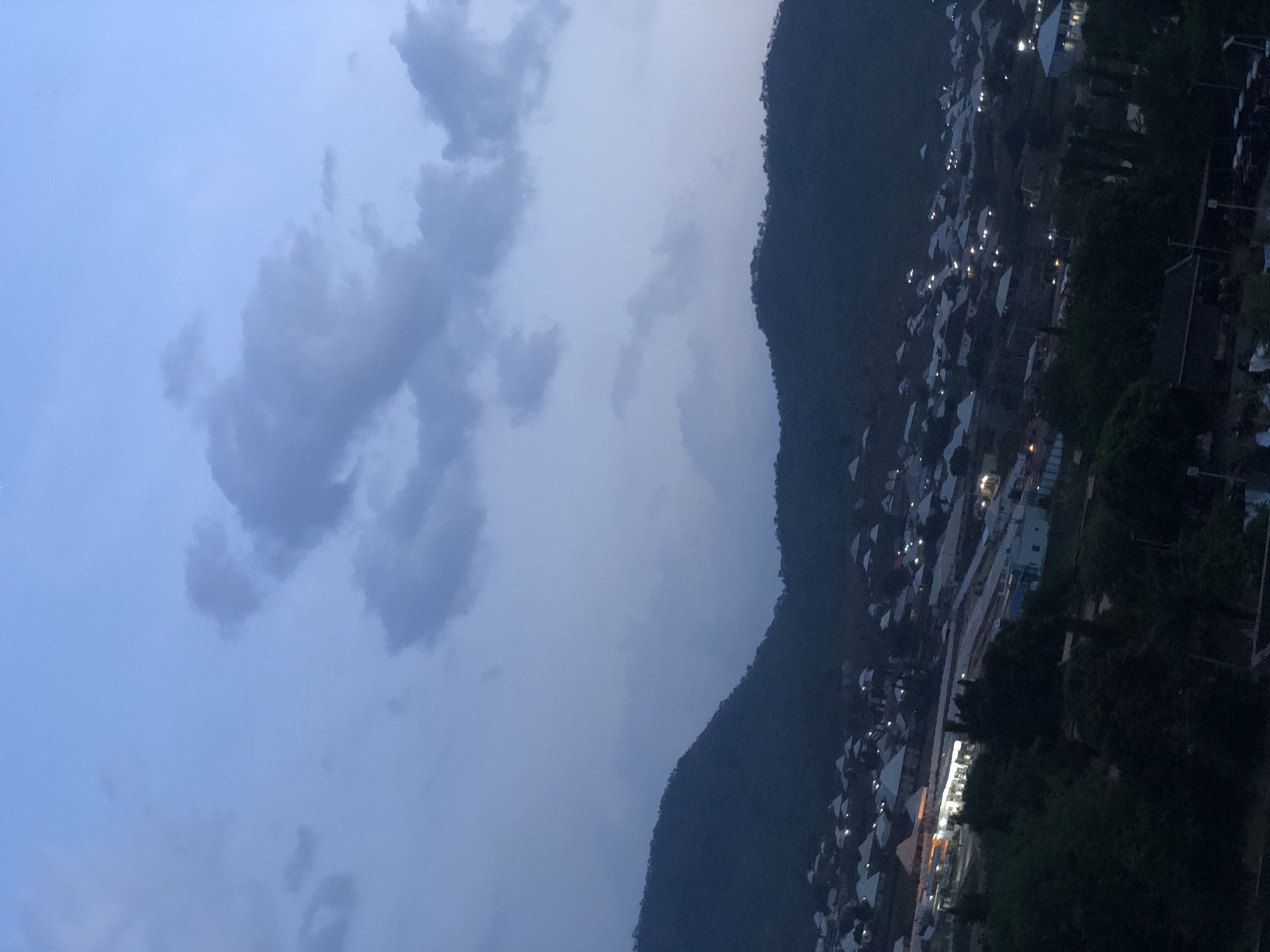 Mountainous settlement photographed at dusk by unknown witness