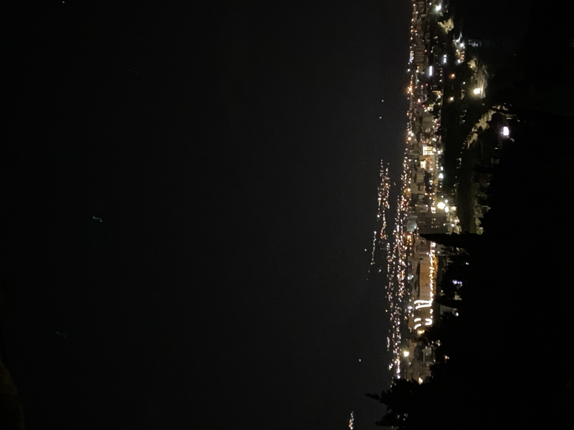 Nighttime cityscape view captured from elevated perspective in Šušanj