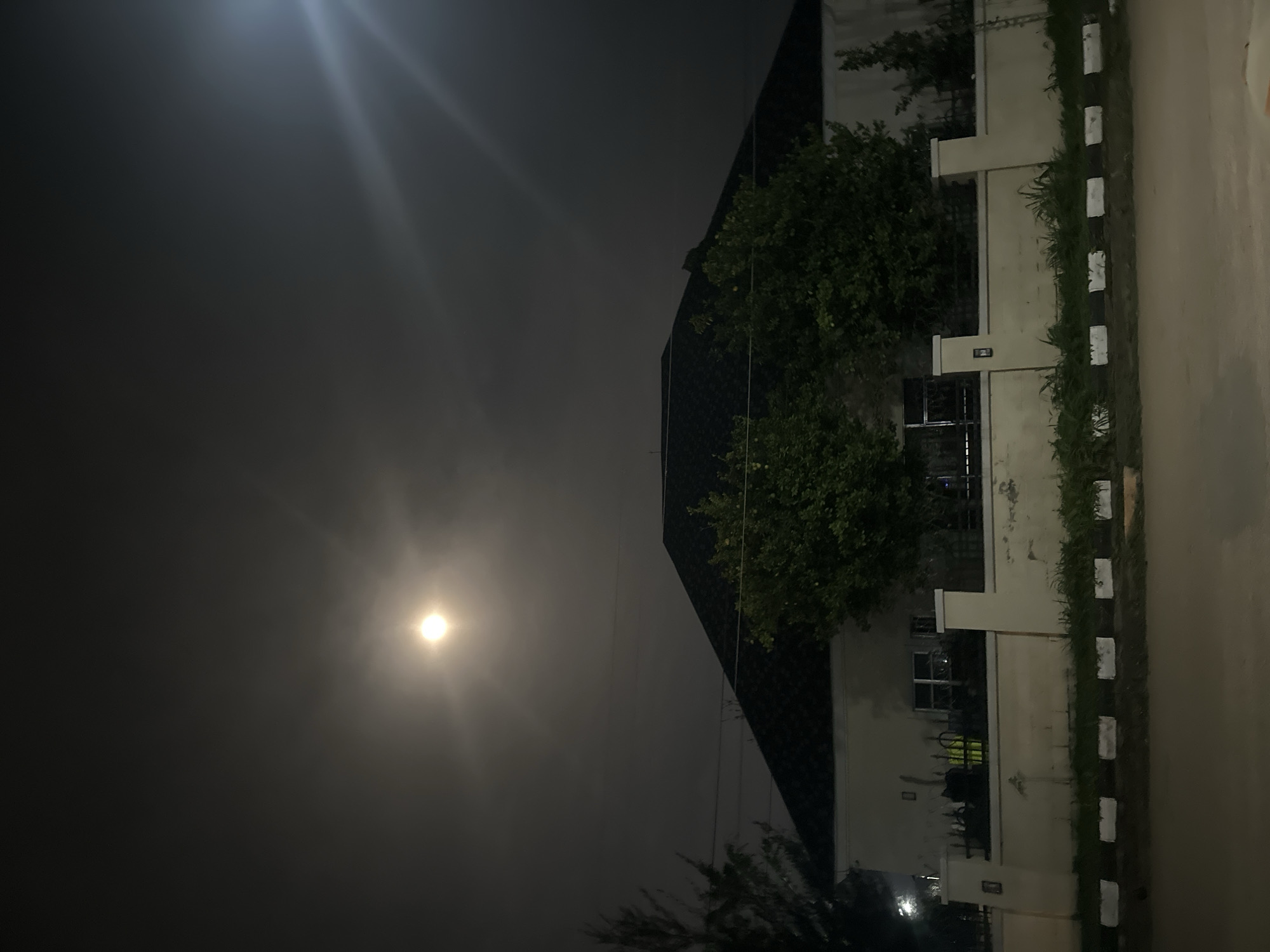 Moonlit streets and residential buildings in Abuja at night