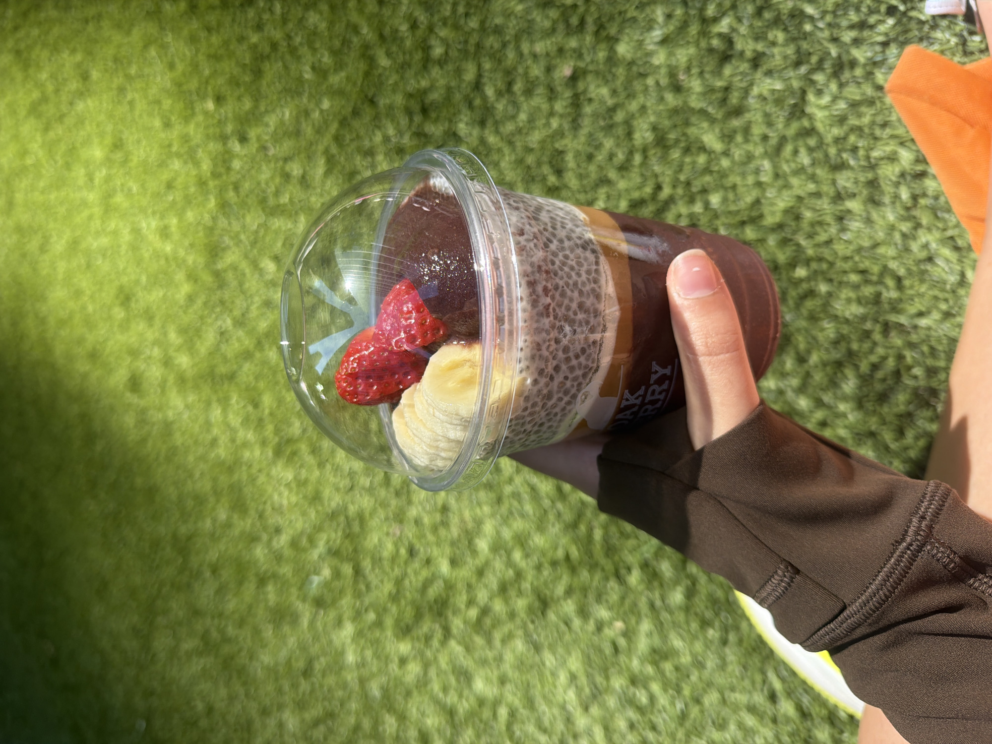 Toronto resident enjoys acai bowl near CN Tower downtown
