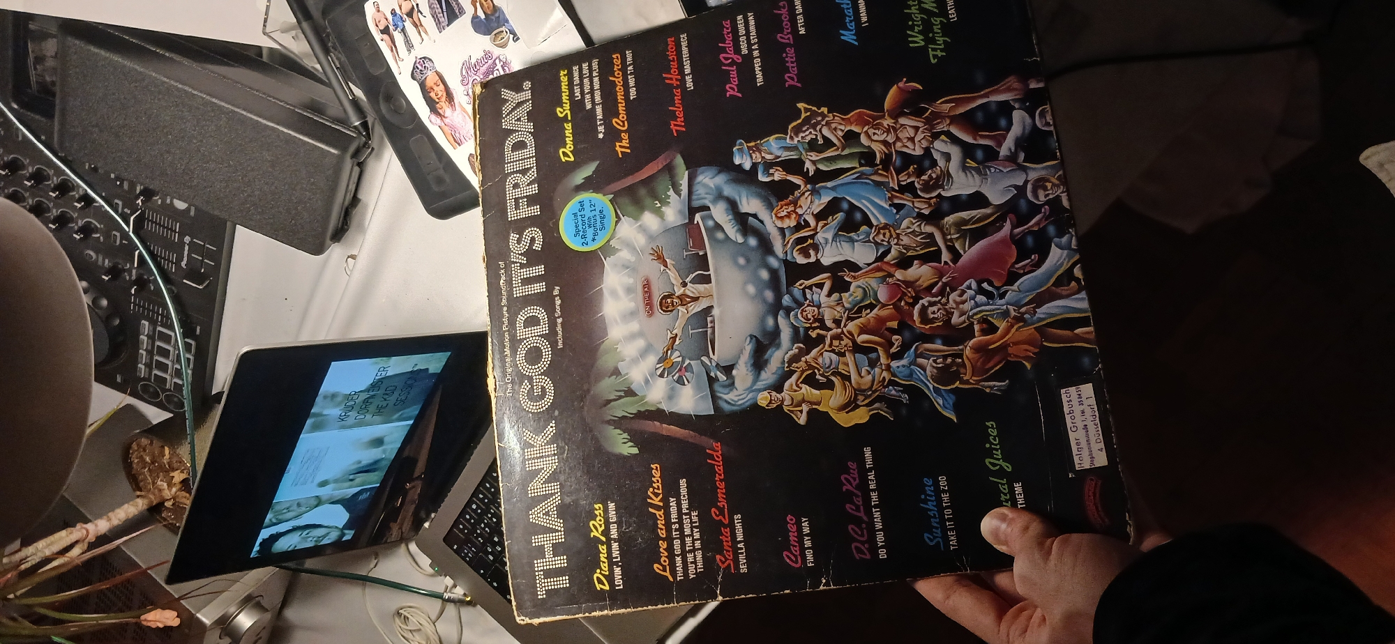 Person displays vintage disco soundtrack while wearing festive headwear
