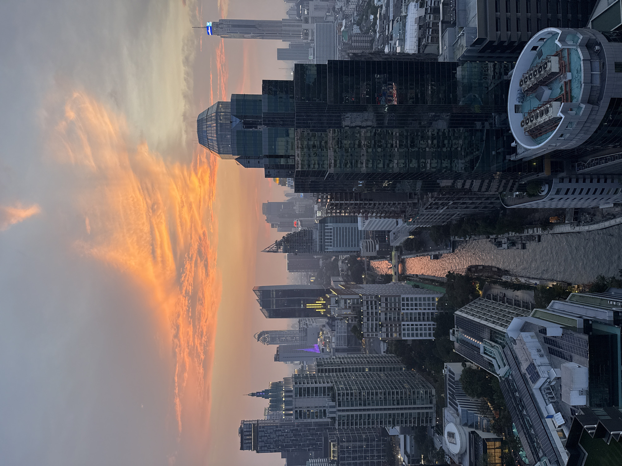 Bangkok sunset captured from elevated view showing skyline, canals