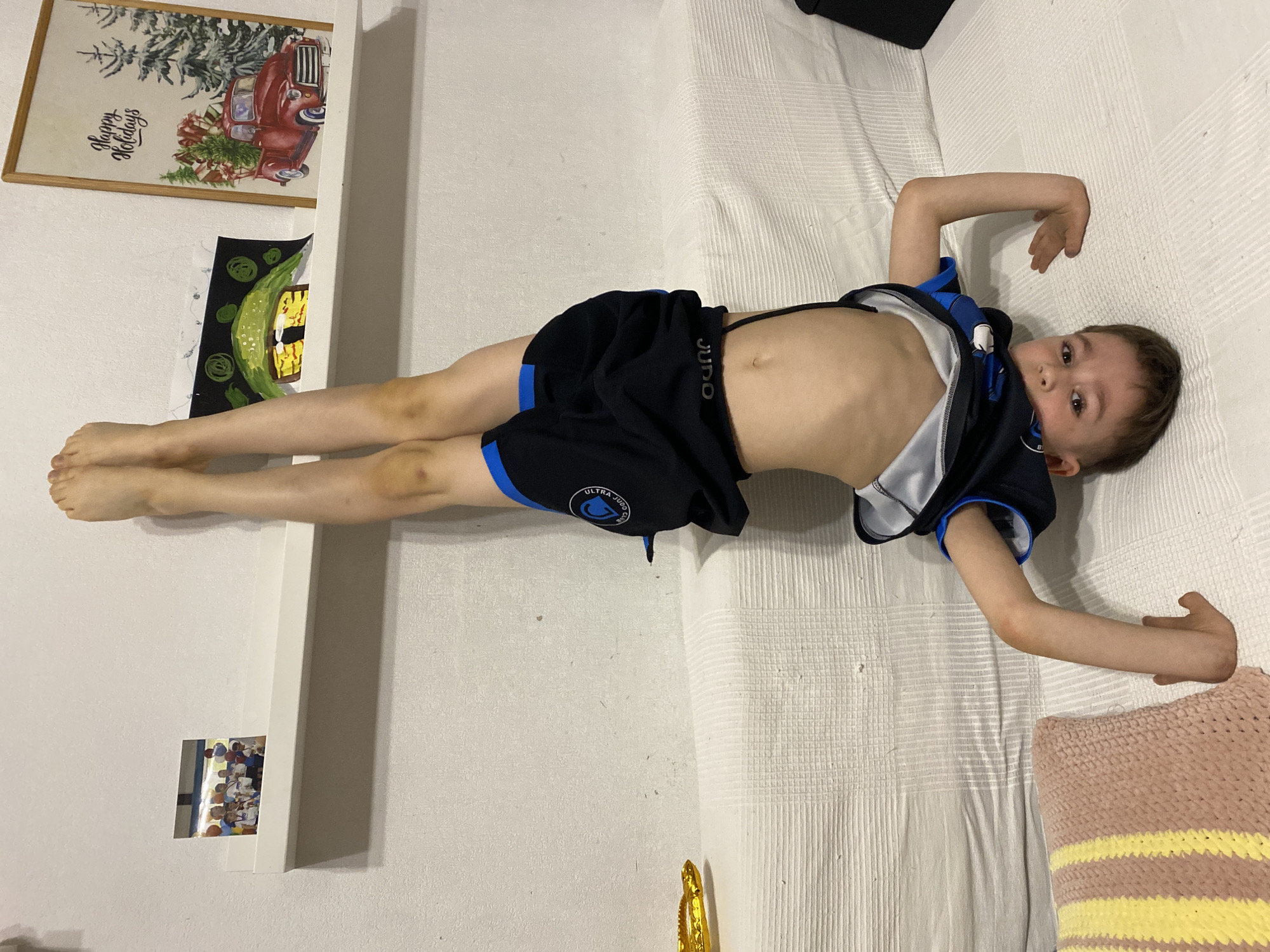 Boy practices gymnastics, cat naps in Yekaterinburg home