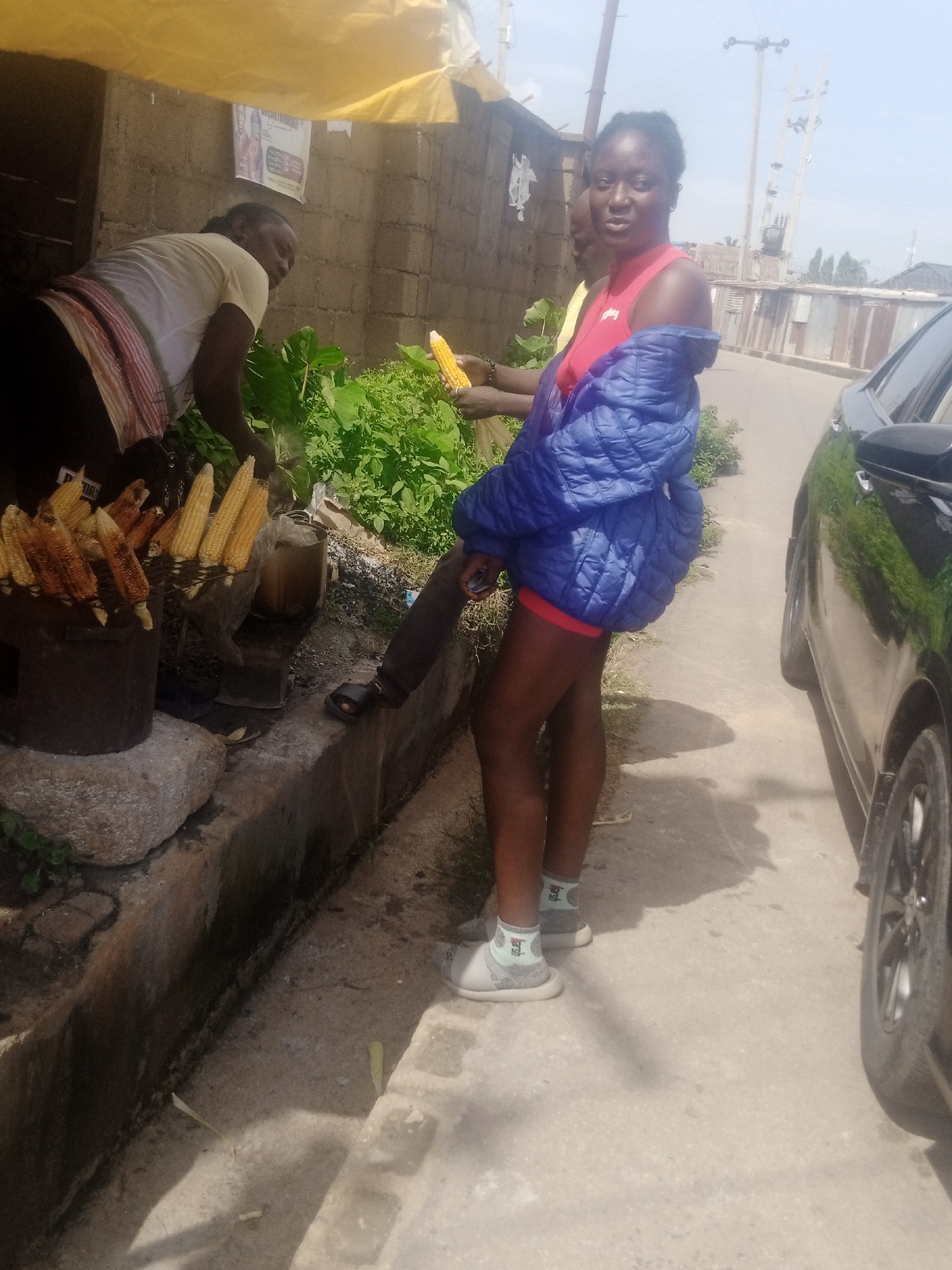 Corn roasting at a roadside stall in Gura Top, Nigeria