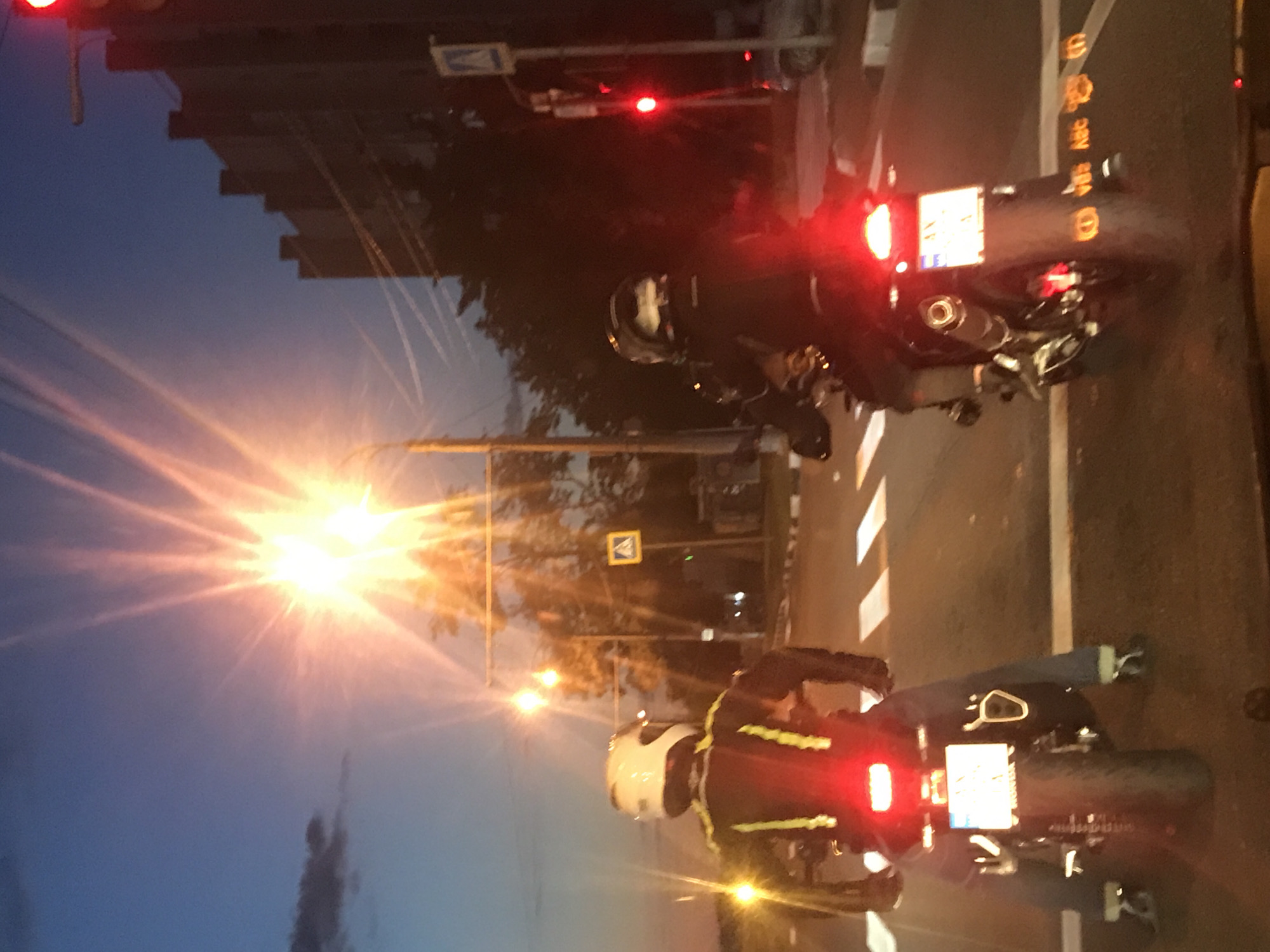 Motorcyclists wait at traffic light during Kharkiv evening rush
