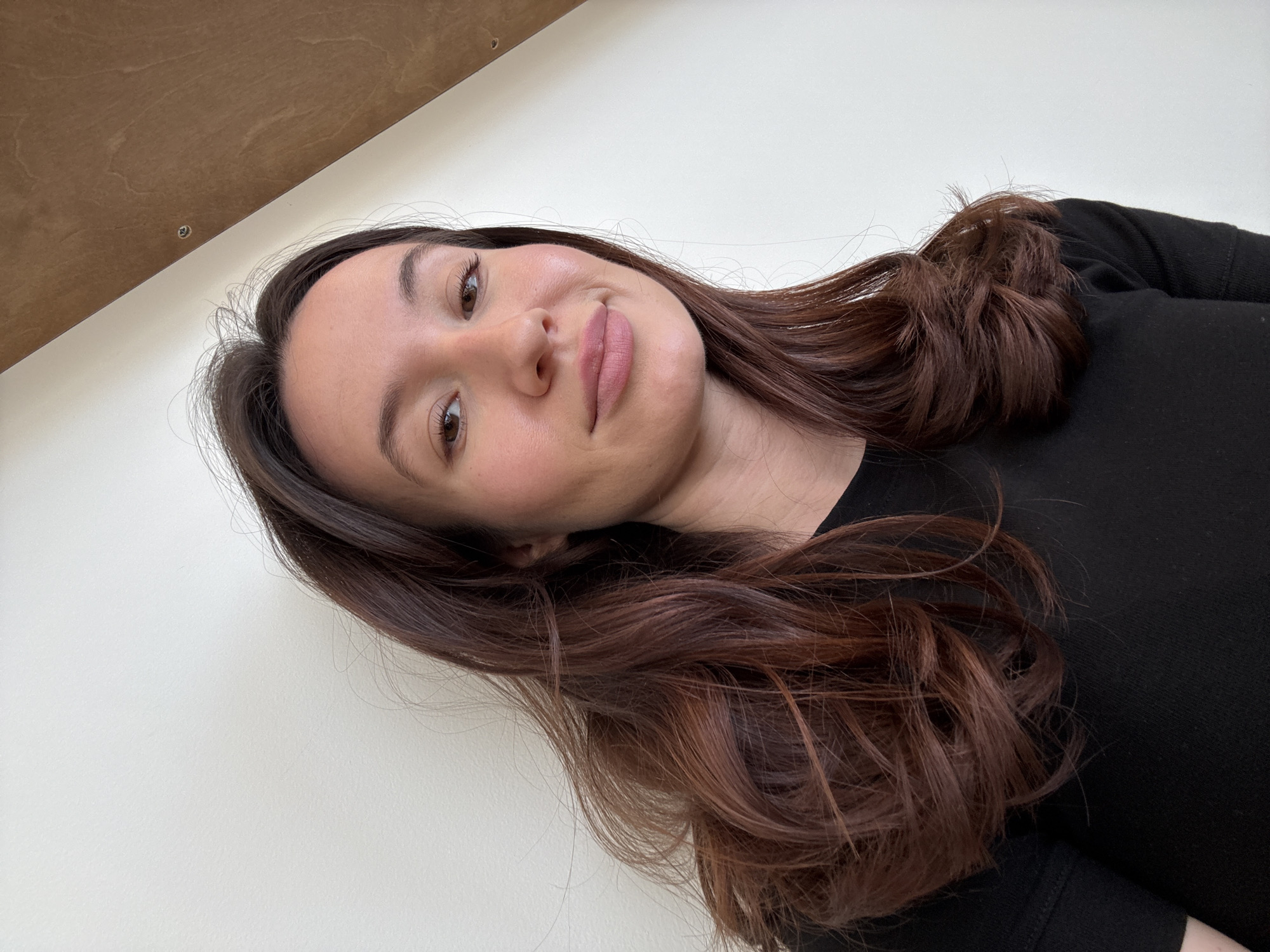 Woman photographed smiling in Tel Aviv indoor setting