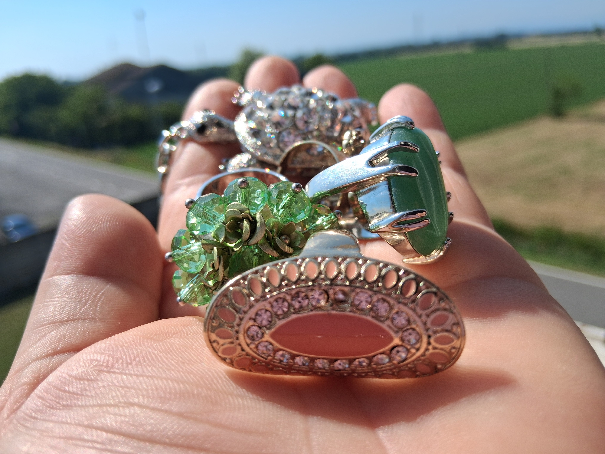 Person displays jewelry collection during morning walk in Colorno