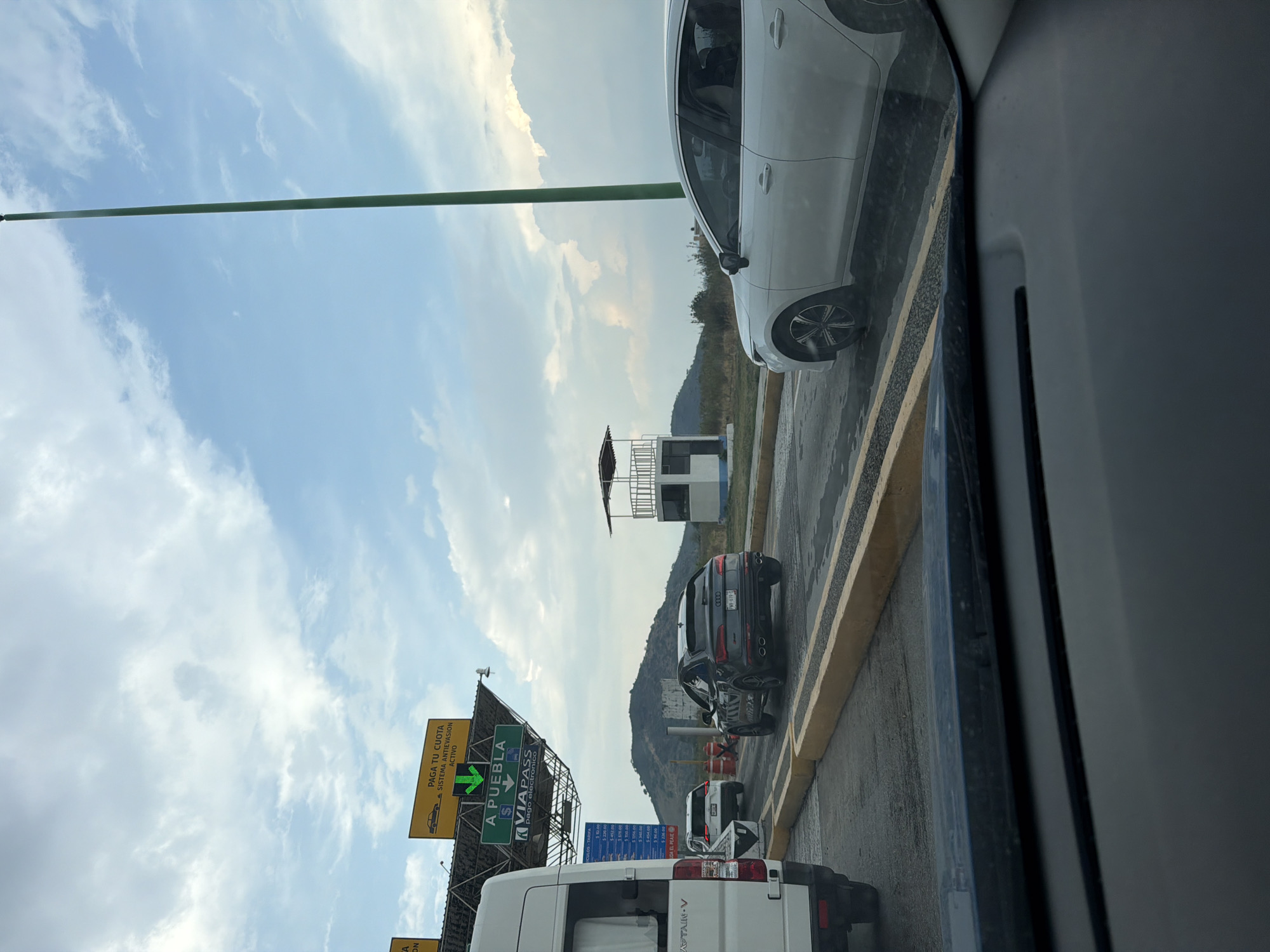 Driver passes through Metepec toll plaza listening to music