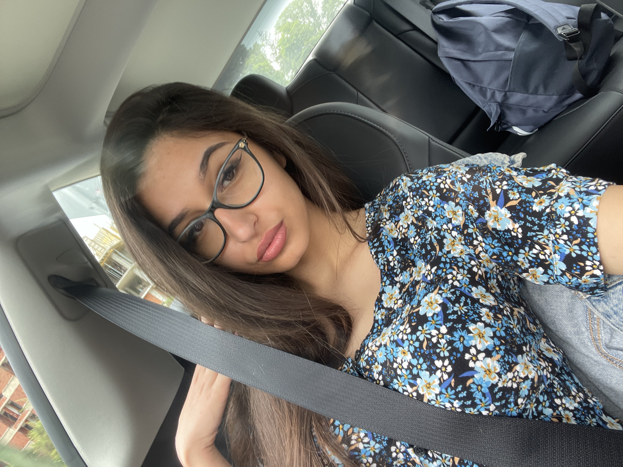 Woman in floral top travels by car in Velingrad