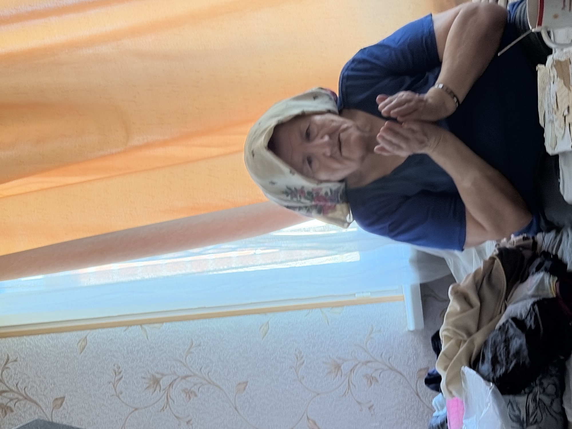Quiet afternoon indoors in Tambov — person and pet at rest