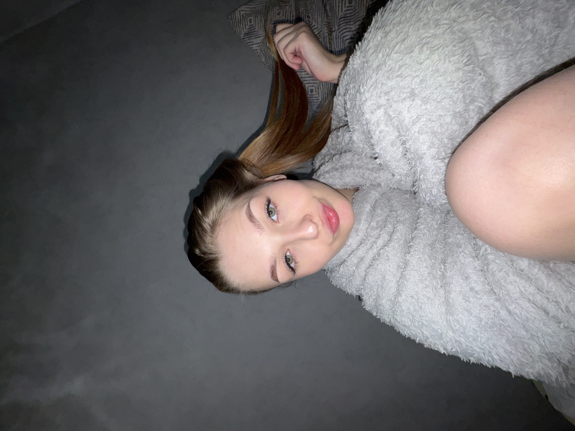 Woman photographed in bedroom setting in Chaikovsky, Russia