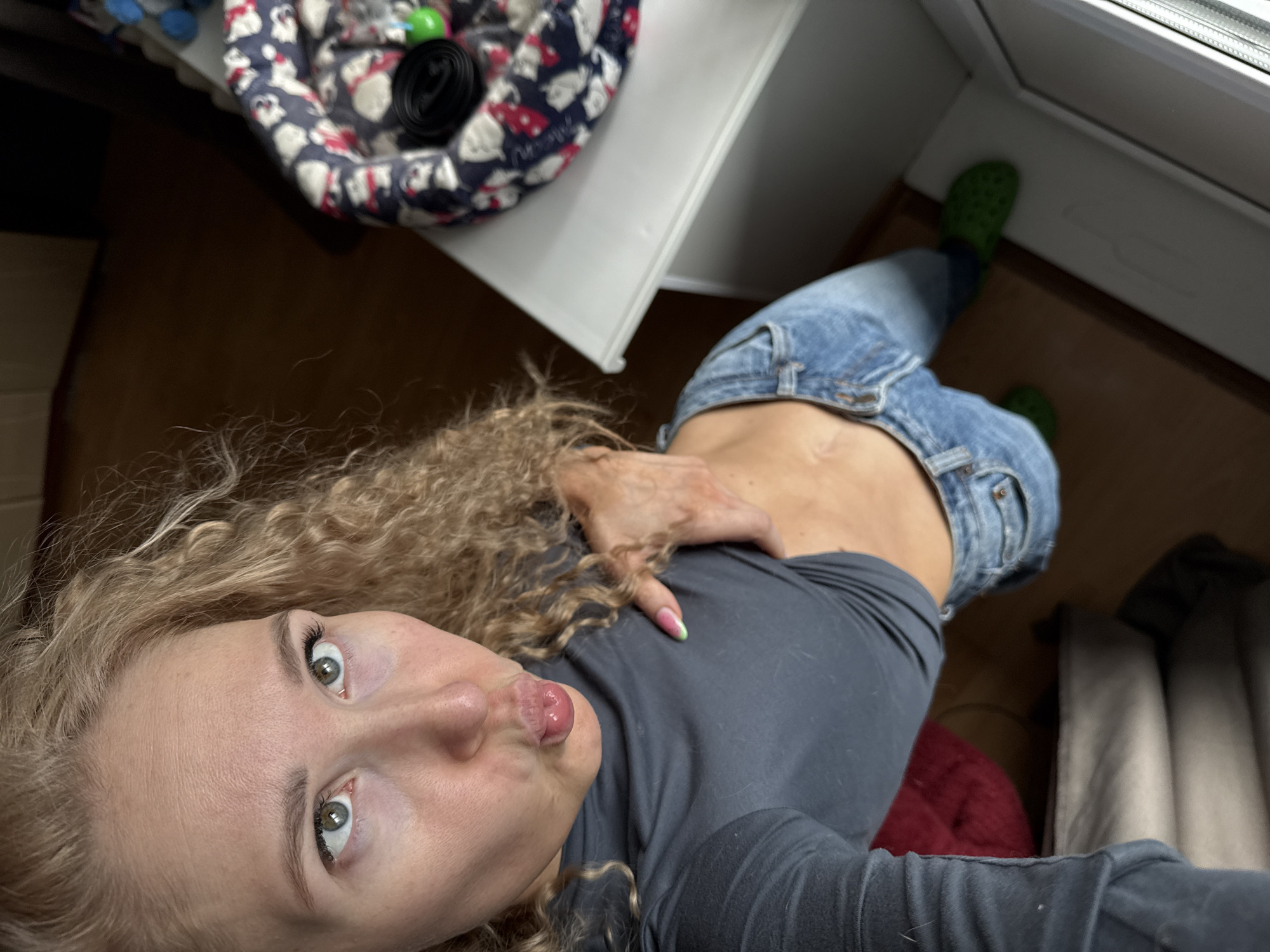 Woman photographs herself in early morning Perm selfie session