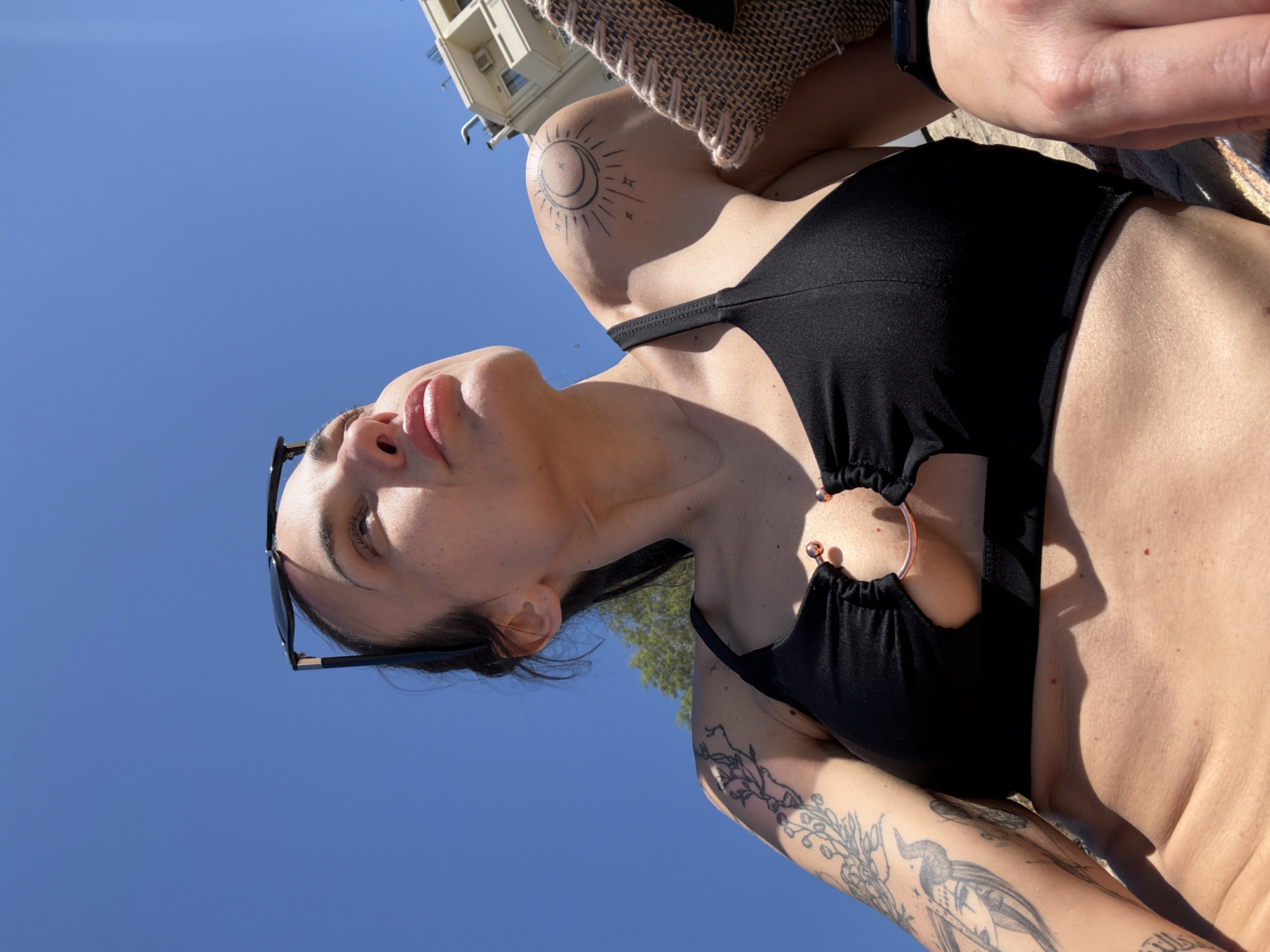 Woman enjoys sunny beach day in Chania, Greece