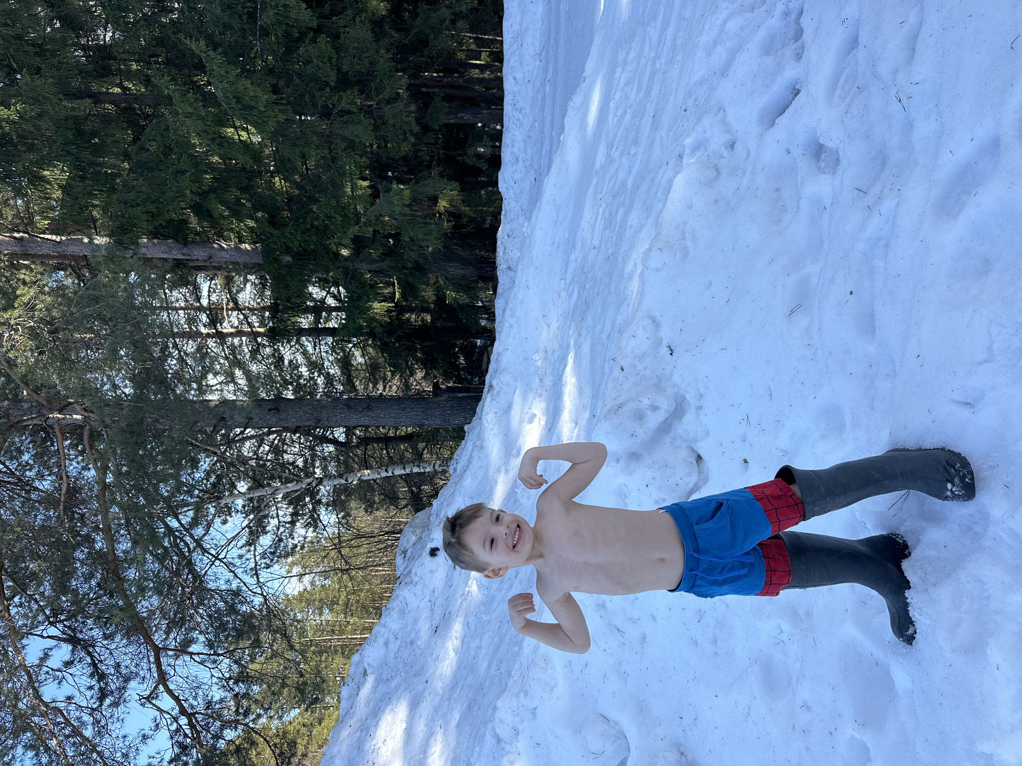 Family enjoys sunny winter day outdoors in Прикамский Russia
