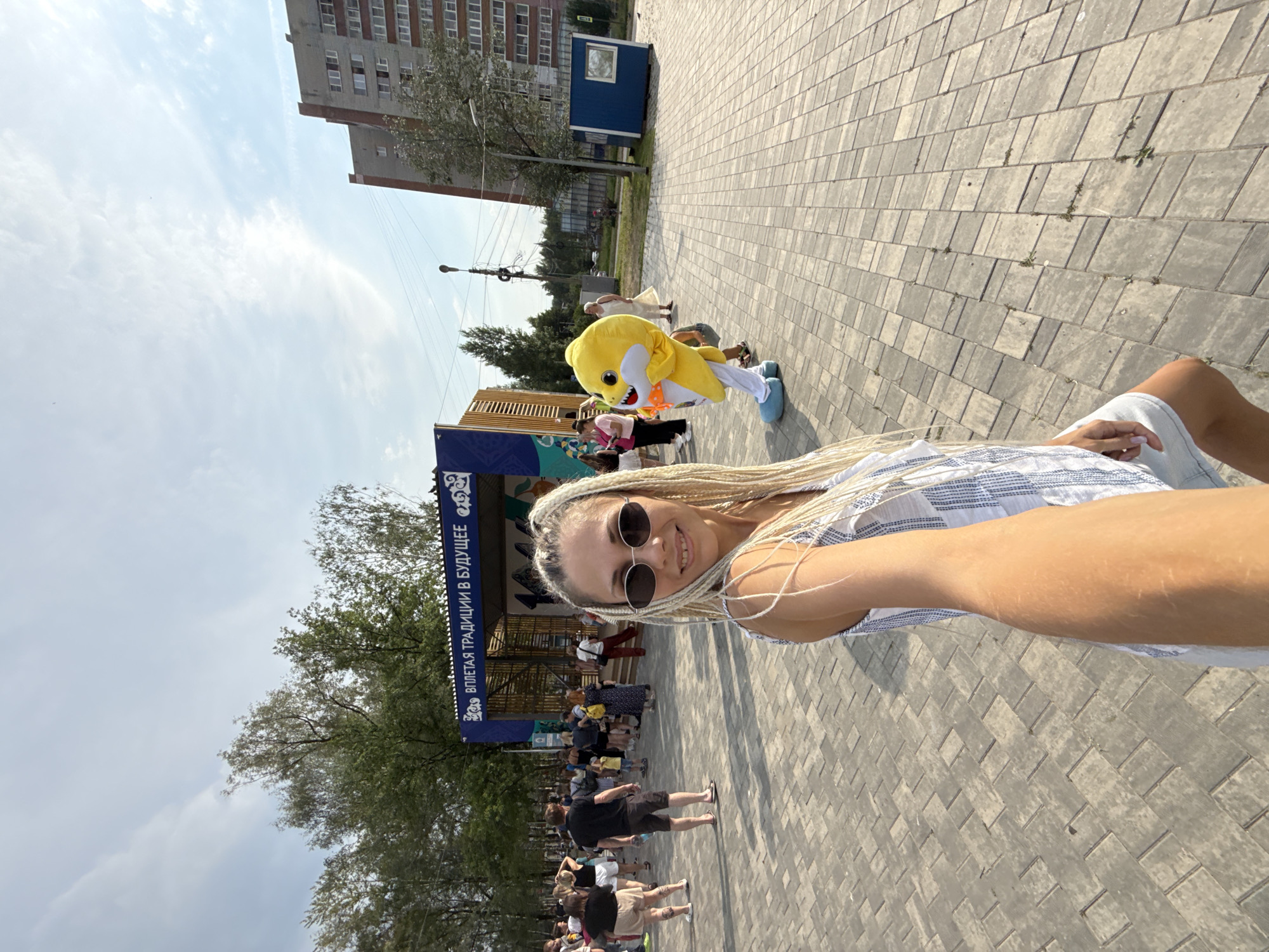 Lakeside community event in Rusanovo with kids, mascots, and activities