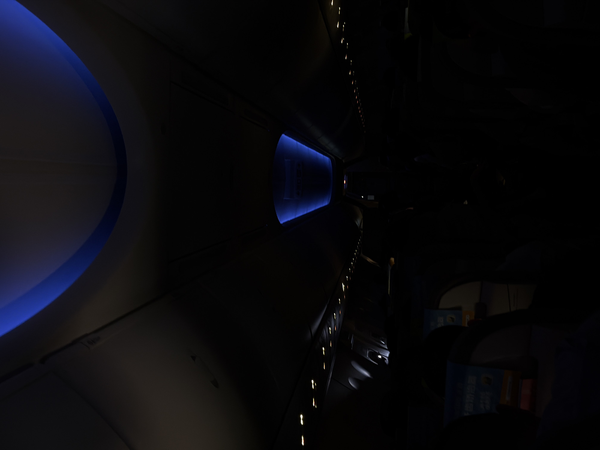 Aircraft cabin interior observed during night flight over Thailand