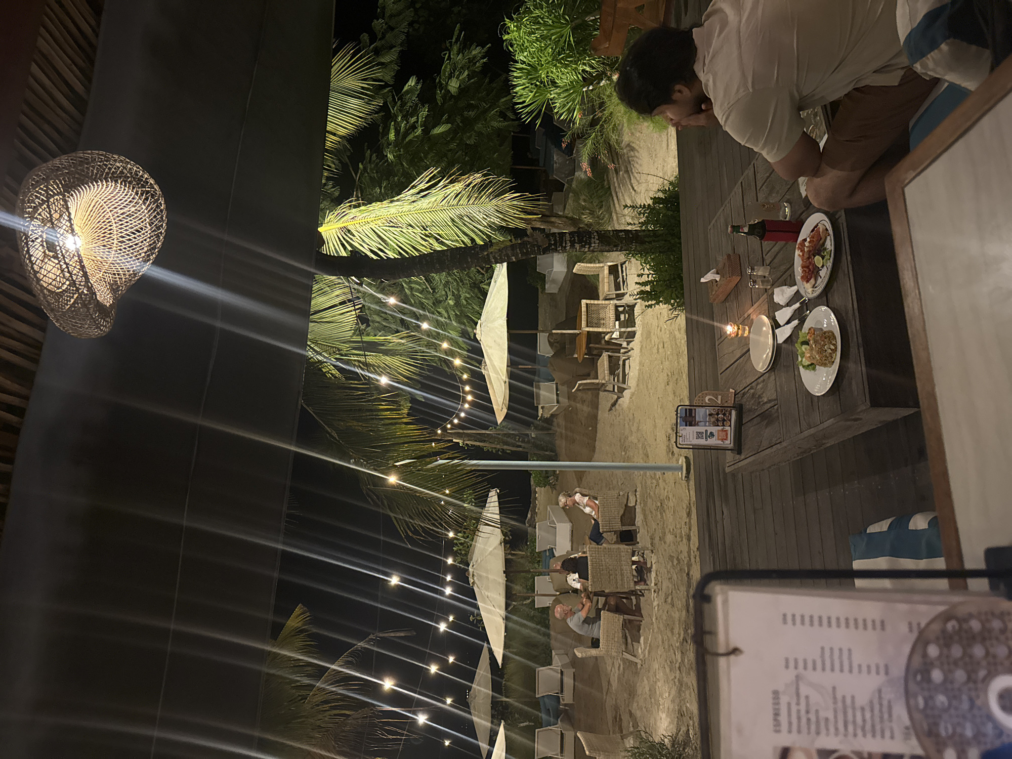 Evening dining and live music at Nusa Penida beachside restaurant