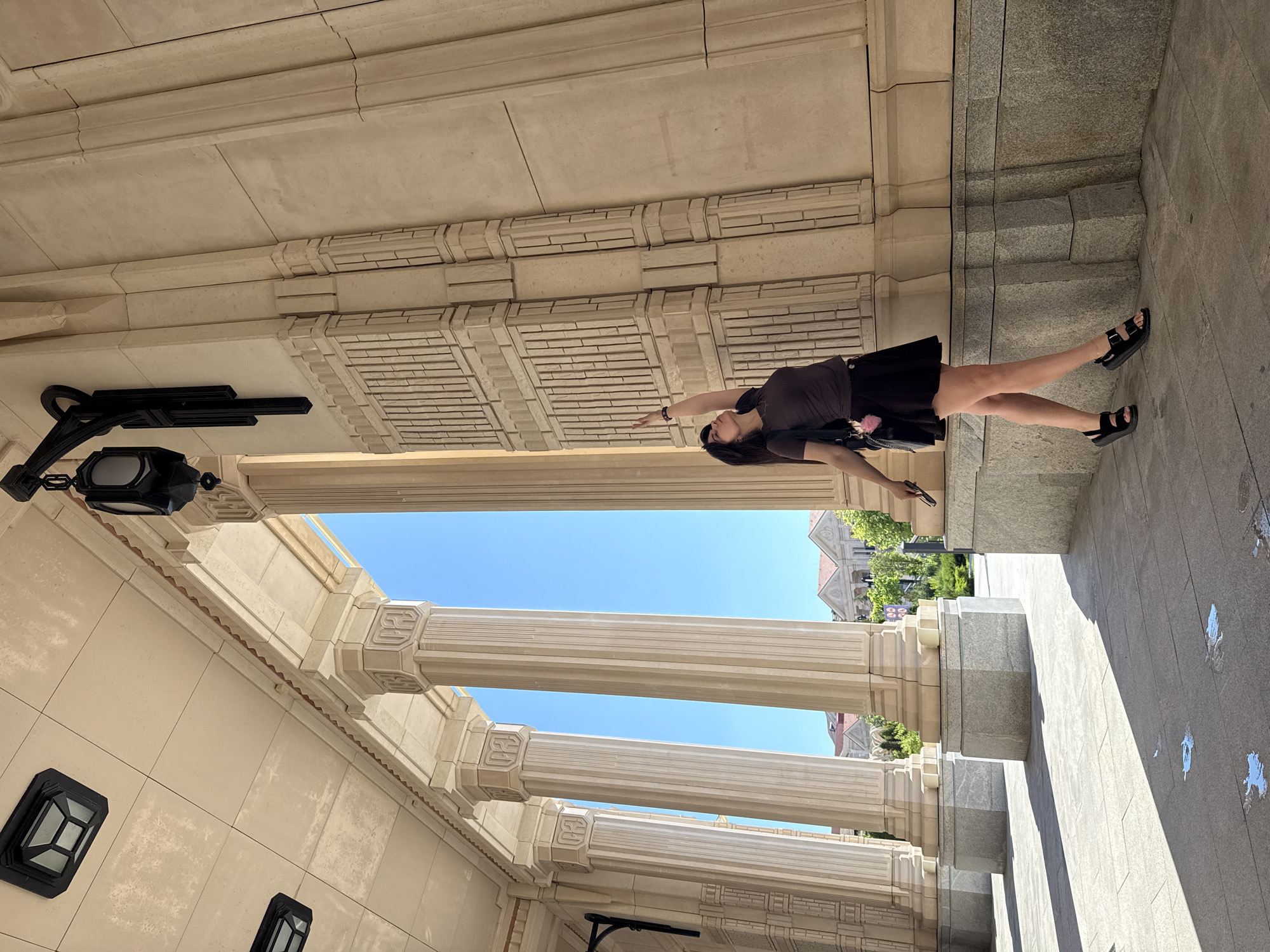 Woman spends afternoon sightseeing at ornate classical building complex