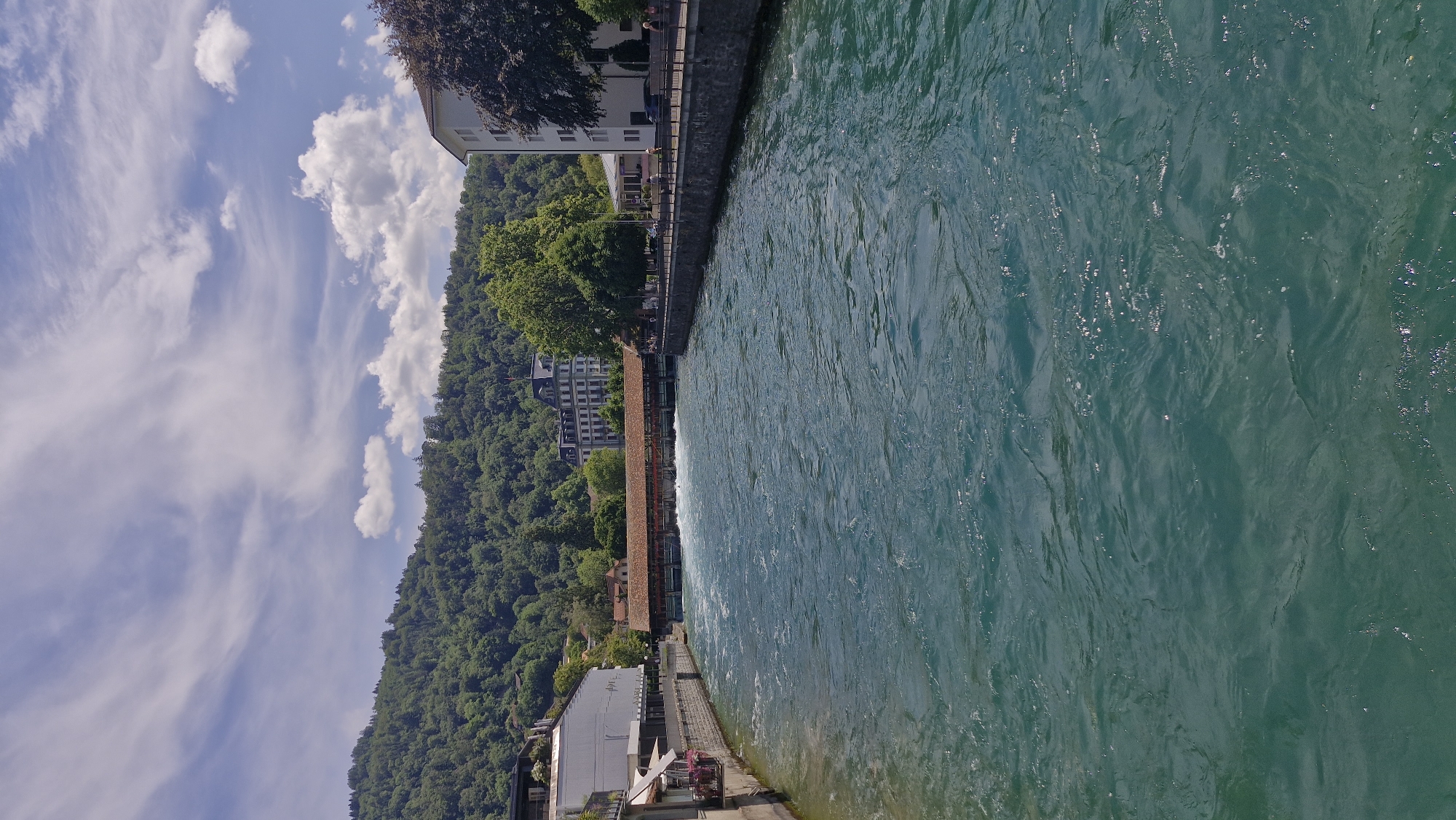 Sunny city day: river views, cobblestone plazas, and street eats