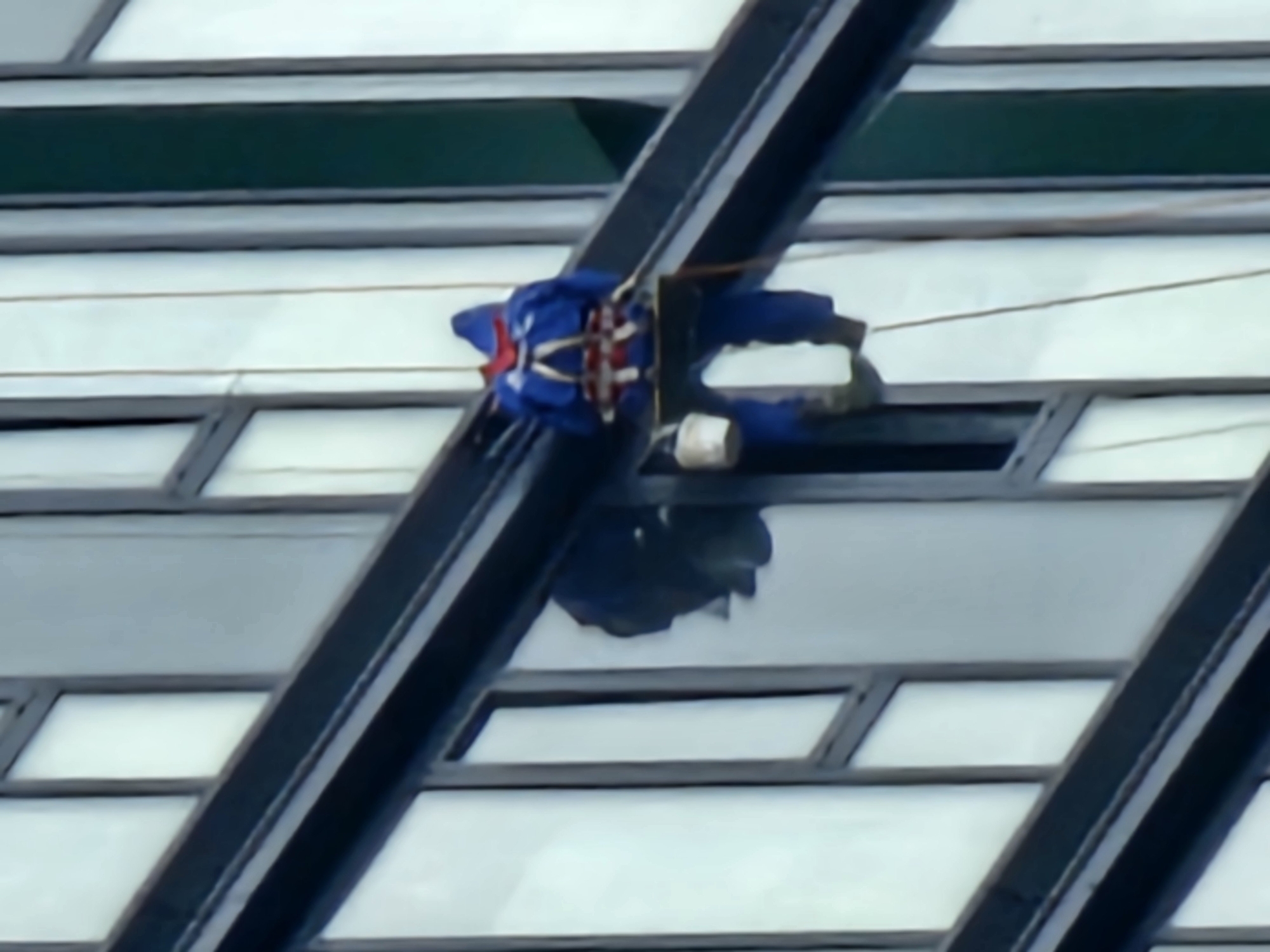 Rope work on a Moscow glass tower, multiple angles