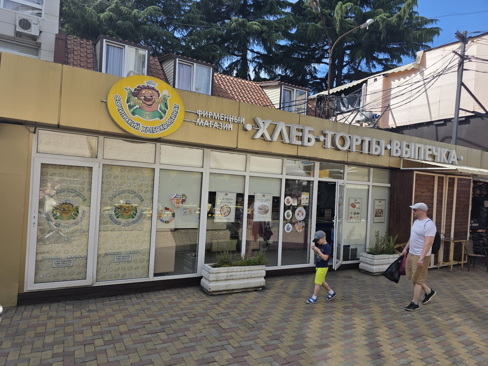Tourist explores Sochi markets and streets during midday stroll
