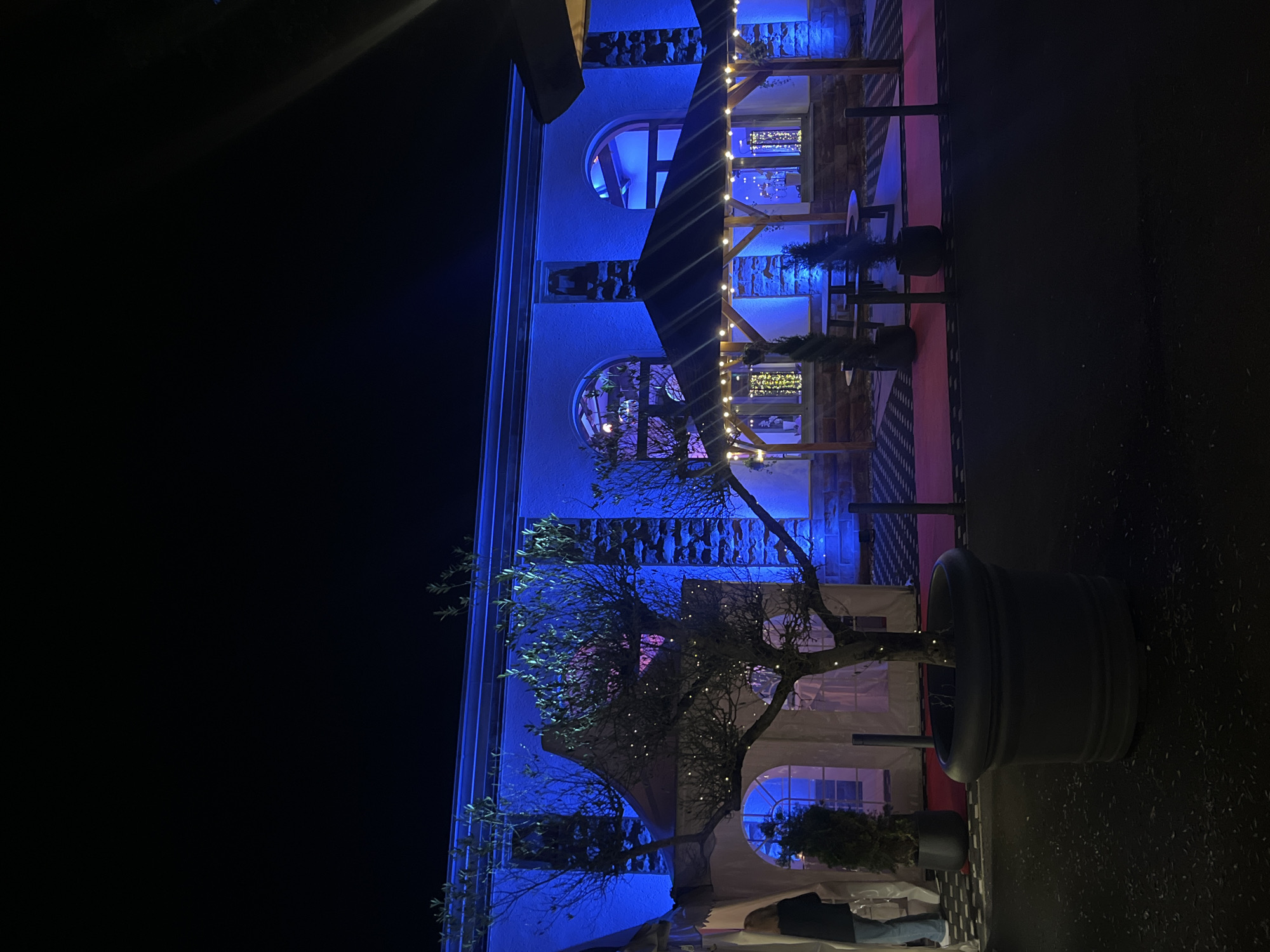 Building illuminated with colorful lights in Saarbrücken nighttime display