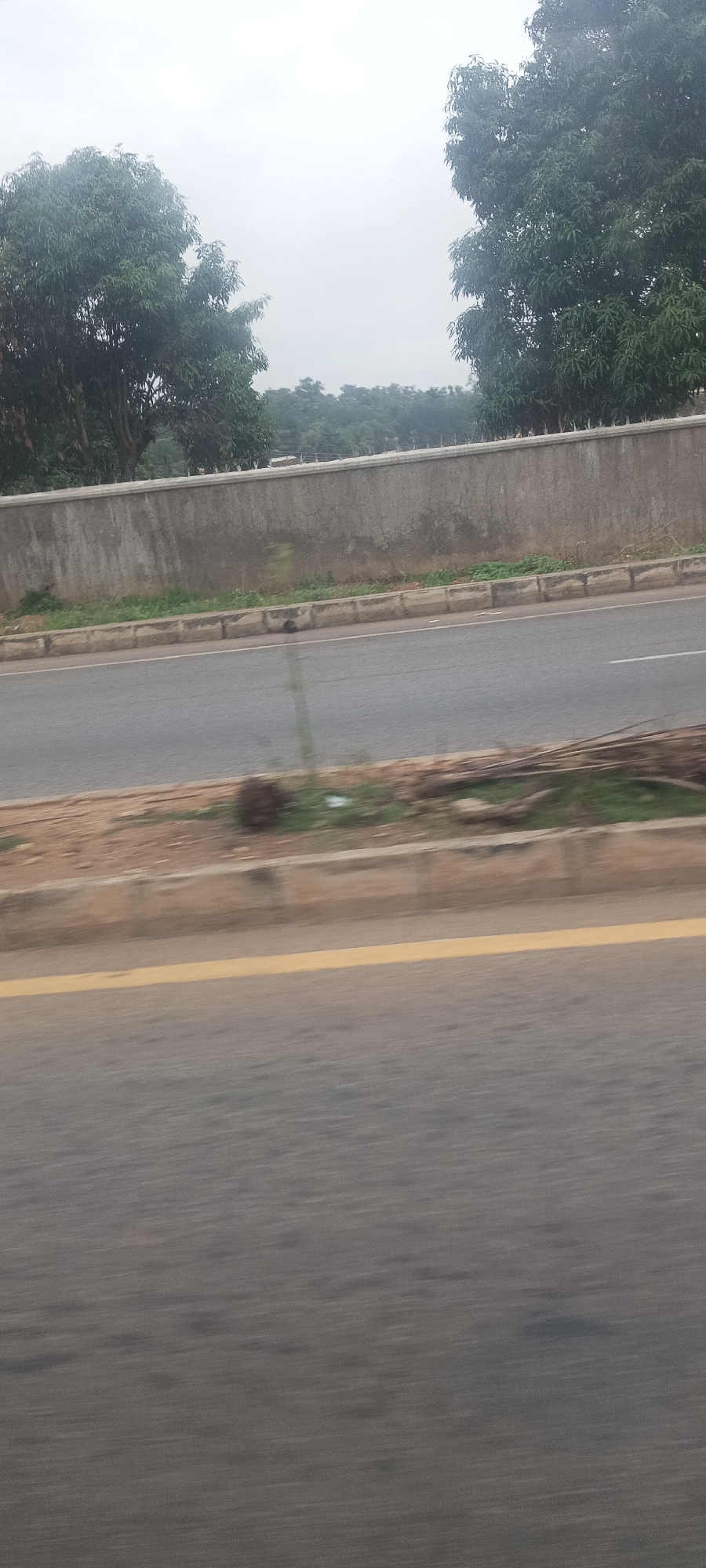 Morning drive through Jos, Nigeria captured in motion-blurred roadside sequence