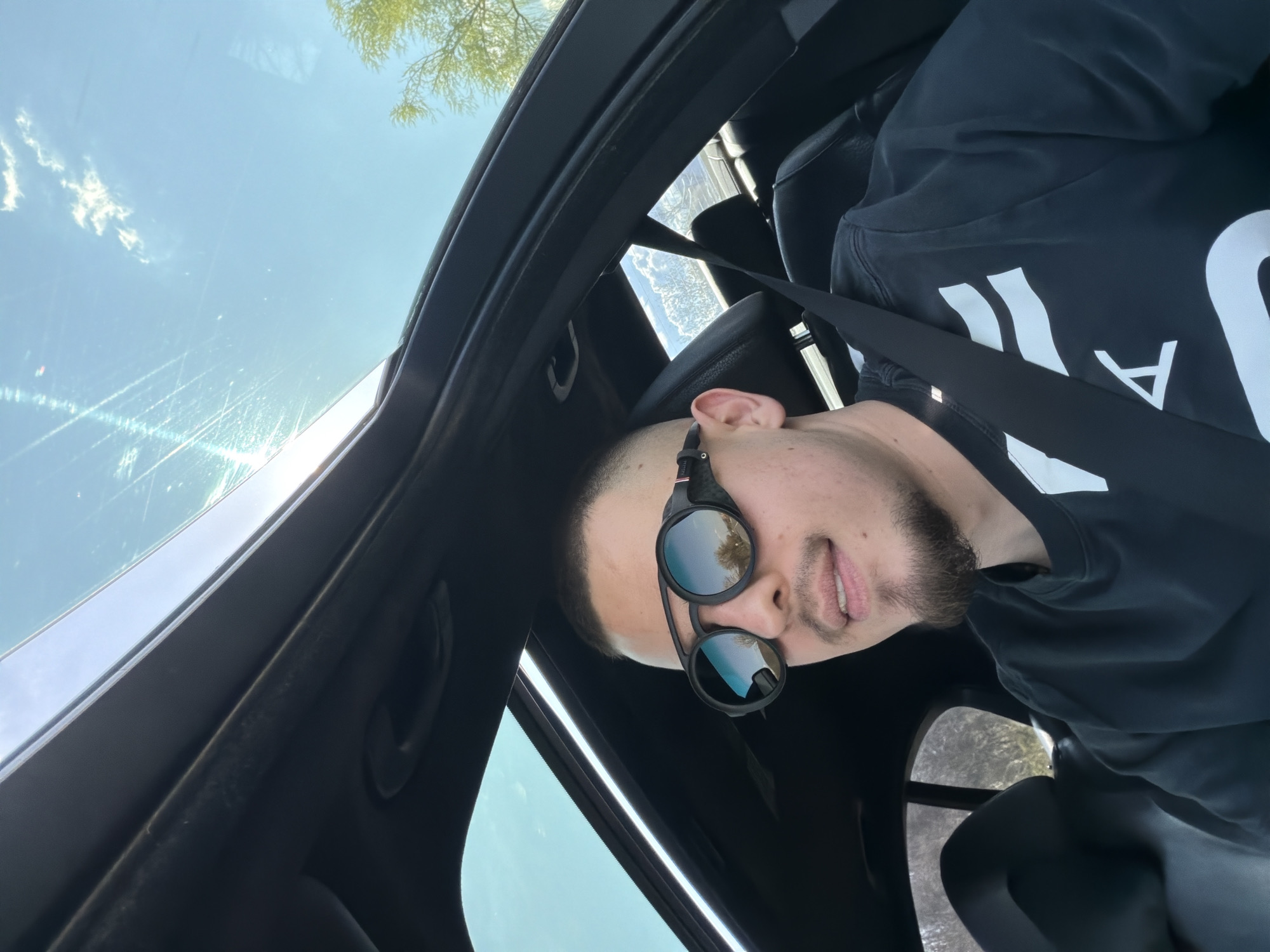 Man in sunglasses observed in car with sunroof in Bulgaria