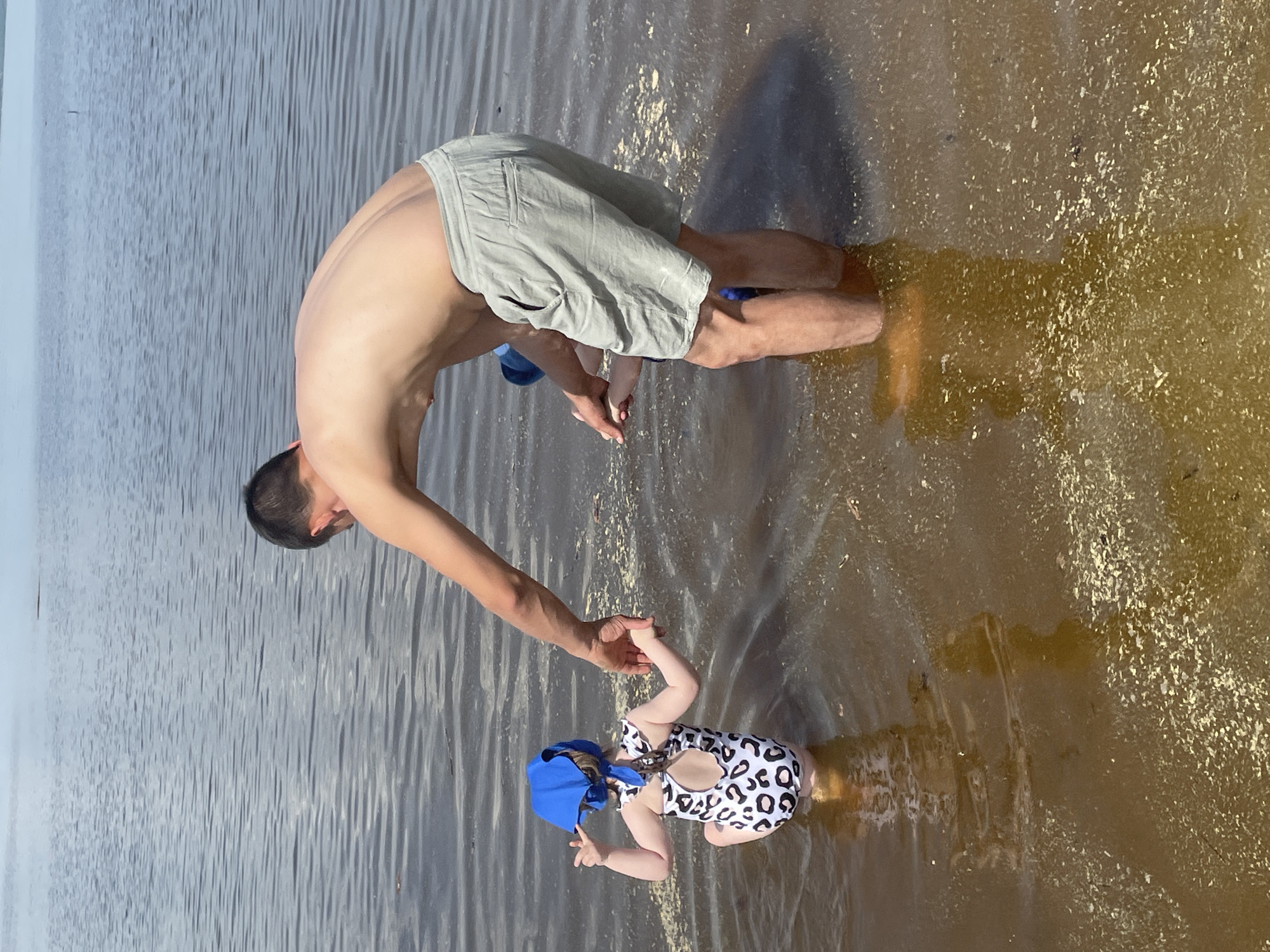 Families enjoy morning beach time along Kama River in Perm